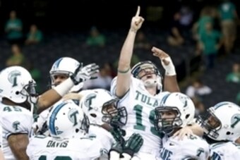 Oct 5, 2013; New Orleans, LA, USA; Tulane Green Wave kicker Cairo Santos (19) is held up by teammates as they celebrate a game winning field goal against the North Texas Mean Green during the fourth quarter at Mercedes-Benz Superdome. Tulane defeated Nort