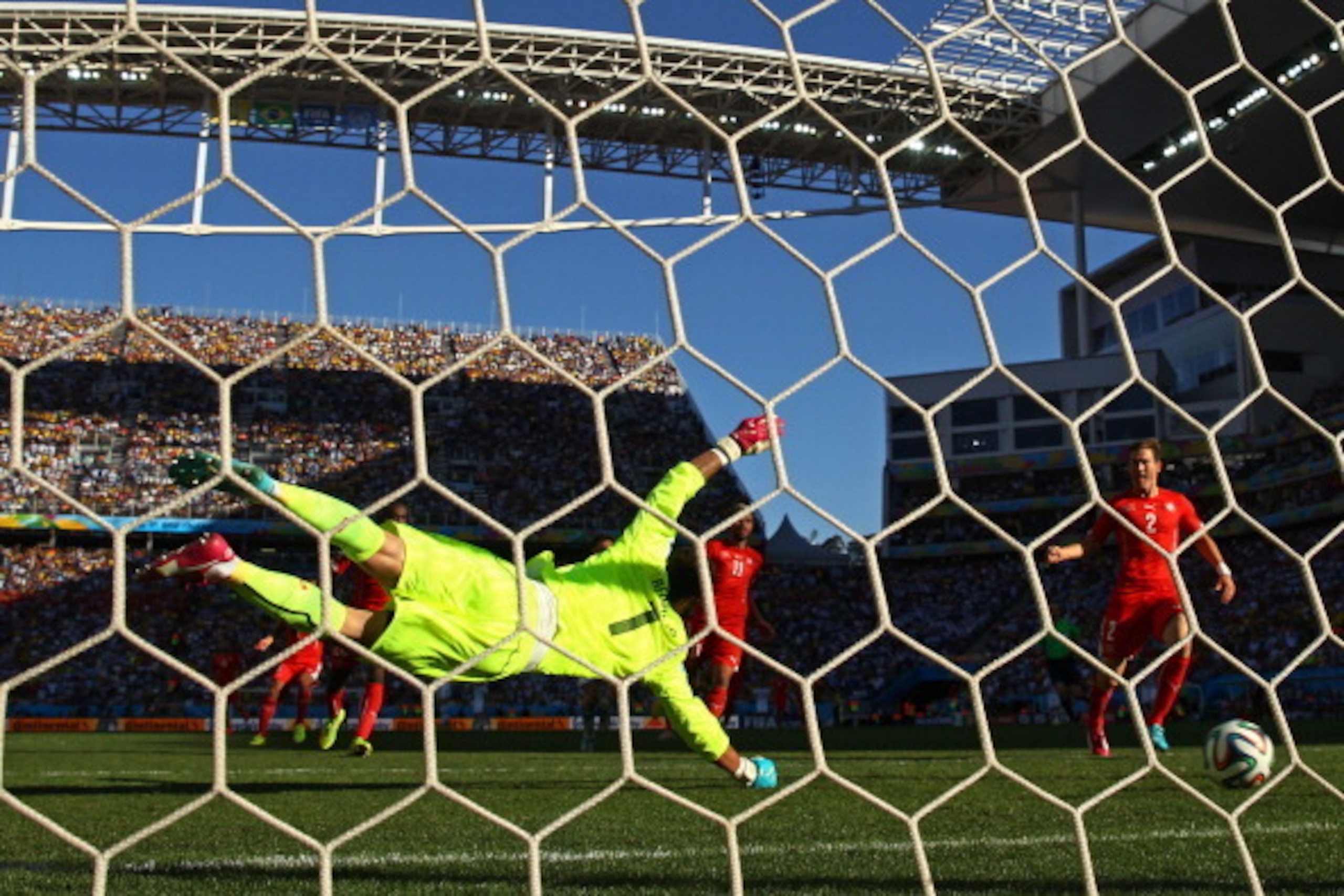 SAO PAULO, BRAZIL - JULY 01:  Diego Benaglio of Switzerland fails to save a shot by Angel di Maria of Argentina (not pictured) for his team's first goal in extra time during the 2014 FIFA World Cup Brazil Round of 16 match between Argentina and Switzerlan