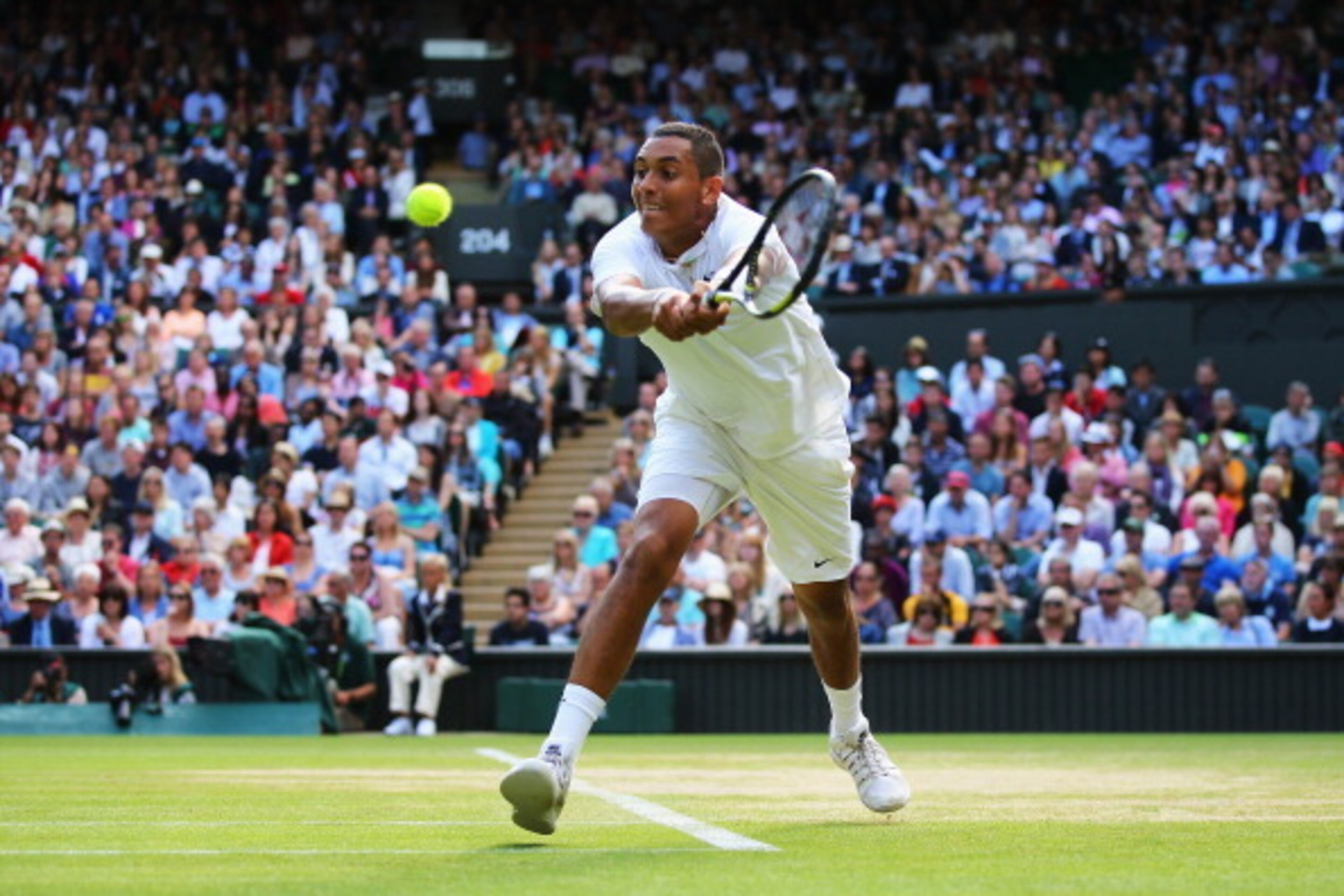 LONDON, ENGLAND - JULY 01: Nick Kyrgios of Australia plays a backhand return during his Gentlemen's Singles fourth round match against Rafael Nadal of Spain on day eight of the Wimbledon Lawn Tennis Championships at the All England Lawn Tennis and Croque LONDON, ENGLAND - JULY 01: Nick Kyrgios of Australia plays a backhand return during his Gentlemen's Singles fourth round match against Rafael Nadal of Spain on day eight of the Wimbledon Lawn Tennis Championships at the All England Lawn Tennis and Croque