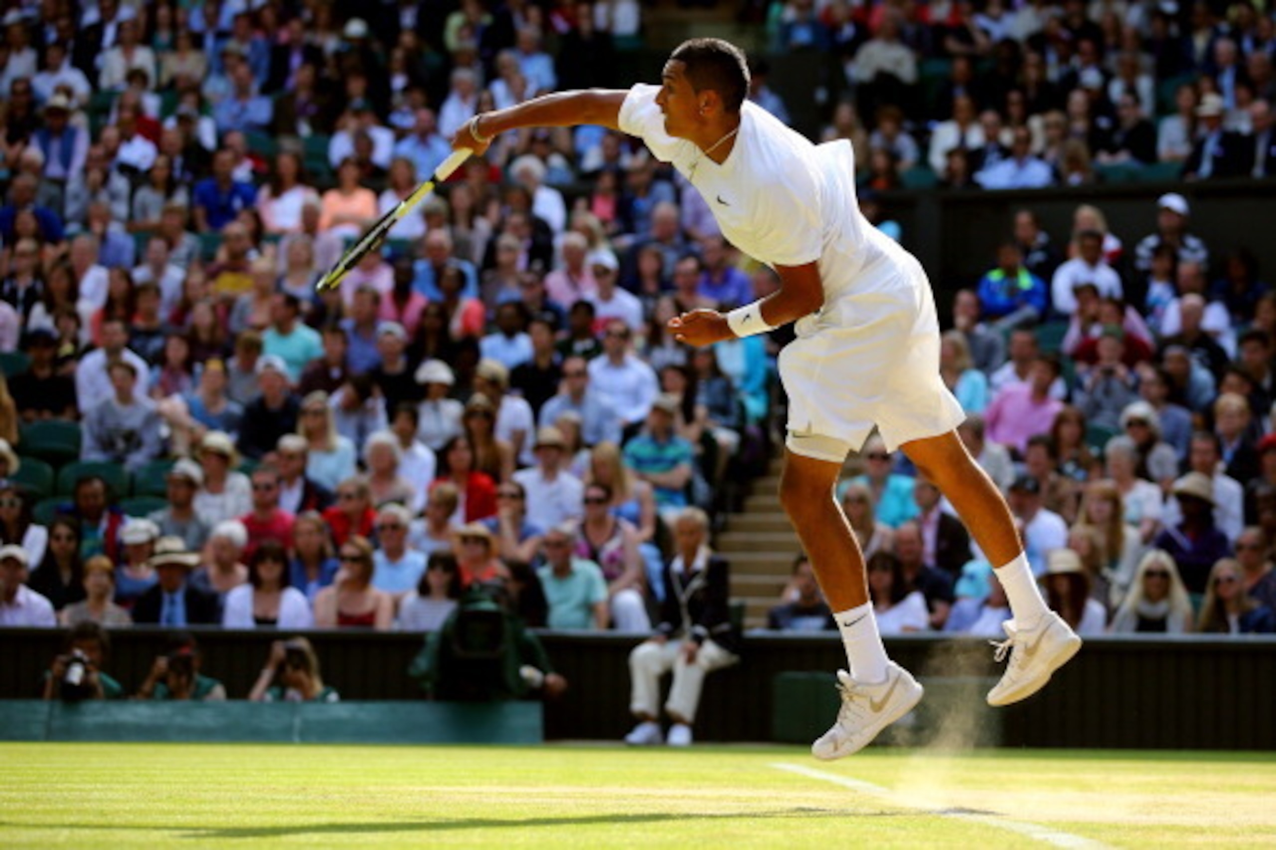 LONDON, ENGLAND - JULY 01:  Nick Kyrgios of Australia serves during his Gentlemen's Singles fourth round match against Rafael Nadal of Spain on day eight of the Wimbledon Lawn Tennis Championships at the All England Lawn Tennis and Croquet Club on July 1,
