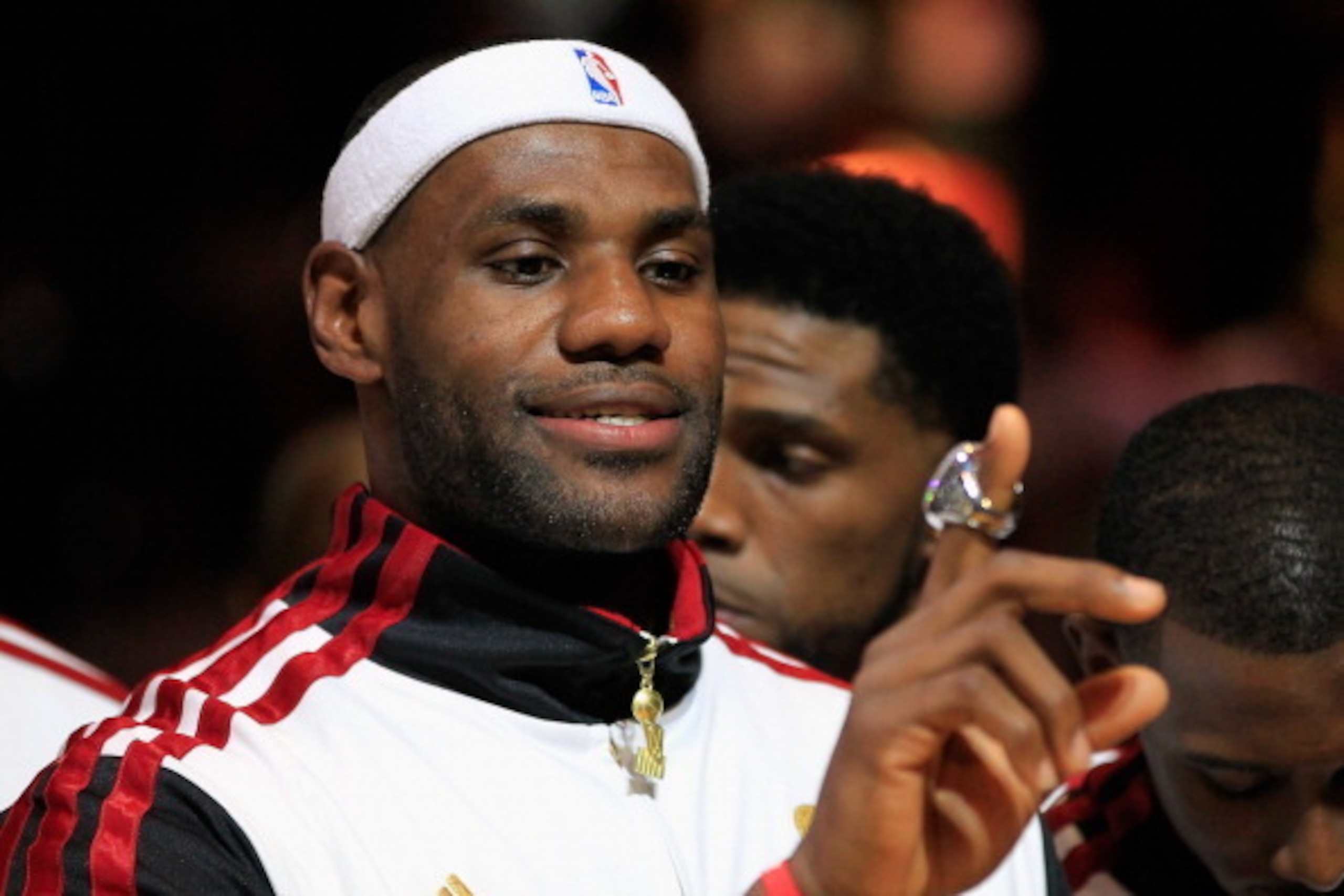 MIAMI, FL - OCTOBER 30:  LeBron James #6 of the Miami Heat looks at his 2012 NBA Championship ring following a ceremony prior to the game against the Boston Celtics at American Airlines Arena on October 30, 2012 in Miami, Florida. NOTE TO USER: User expre