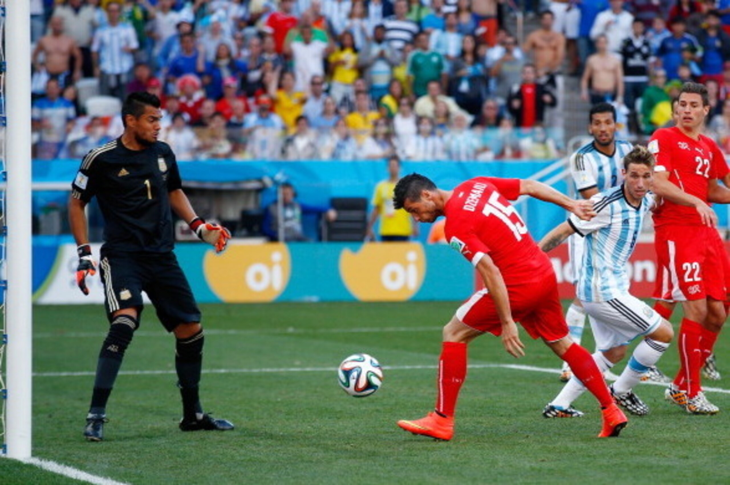 SAO PAULO, BRAZIL - JULY 01:  Blerim Dzemaili of Switzerland shoots the ball toward goal as Sergio Romero of Argentina looks on during the 2014 FIFA World Cup Brazil Round of 16 match between Argentina and Switzerland at Arena de Sao Paulo on July 1, 2014