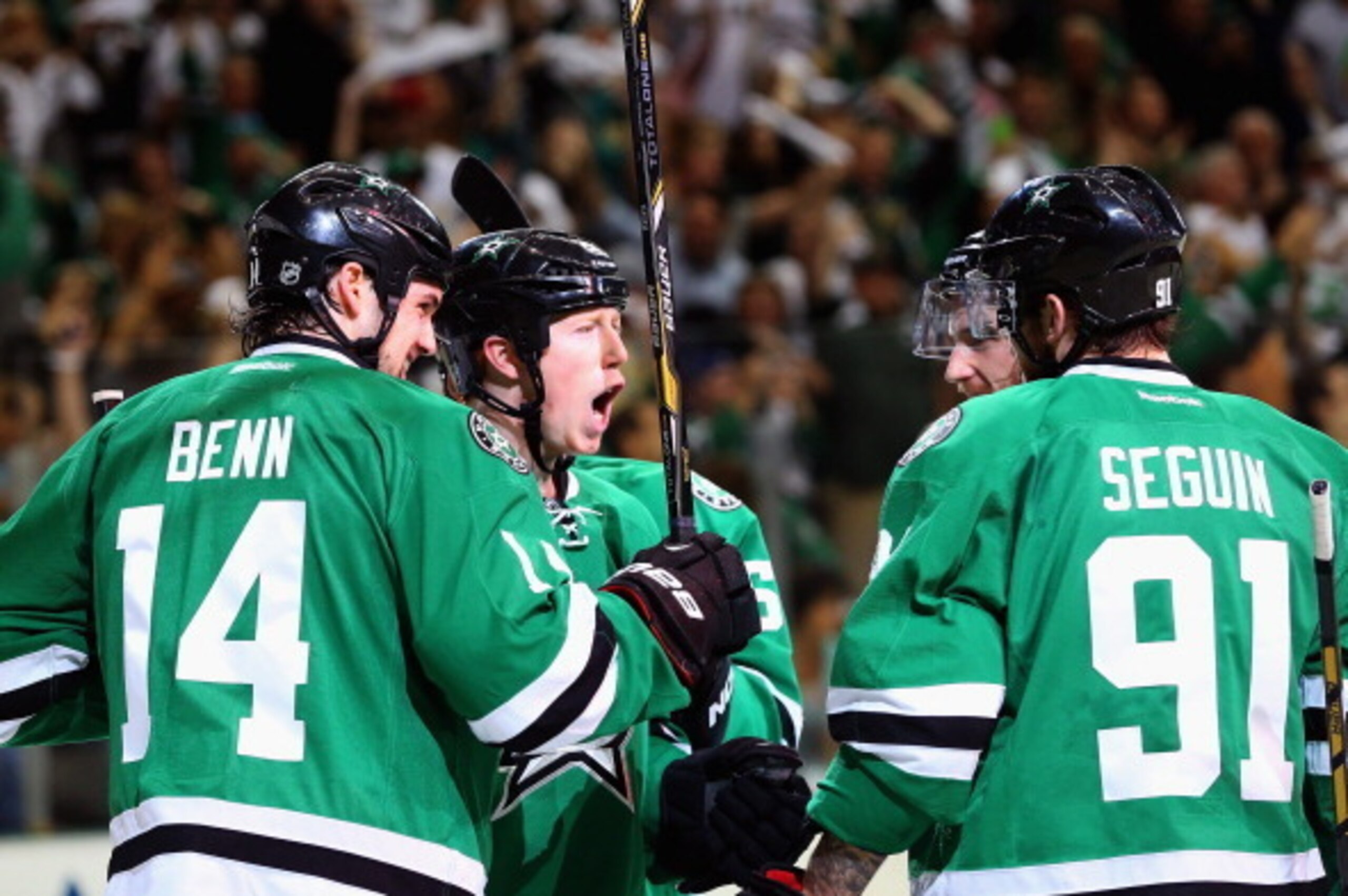 DALLAS, TX - APRIL 27:  Cody Eakin #20 of the Dallas Stars celebrates his goal with Jamie Benn #14 and Tyler Seguin #91 against the Anaheim Ducks in the first period during Game Six of the First Round of the 2014 NHL Stanley Cup Playoffs at American Airli