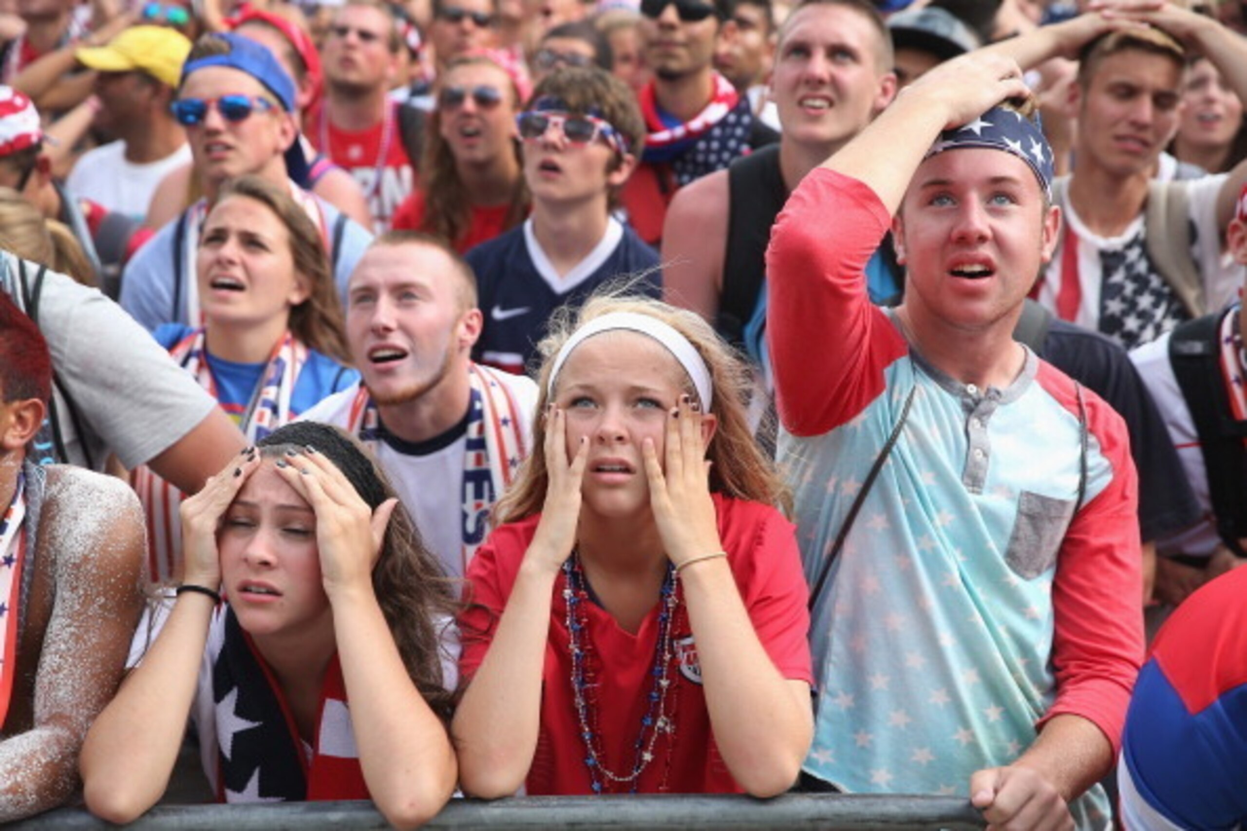 CHICAGO, IL - JULY 01:  Fans react at Soldier Field after Belgium scored on USA in a World Cup match being played at Arena Fonte Nova in Salvador, Brazil on July 1, 2014 in Chicago, Illinois. Organizers said 28,000 people attended the watch party at Soldi