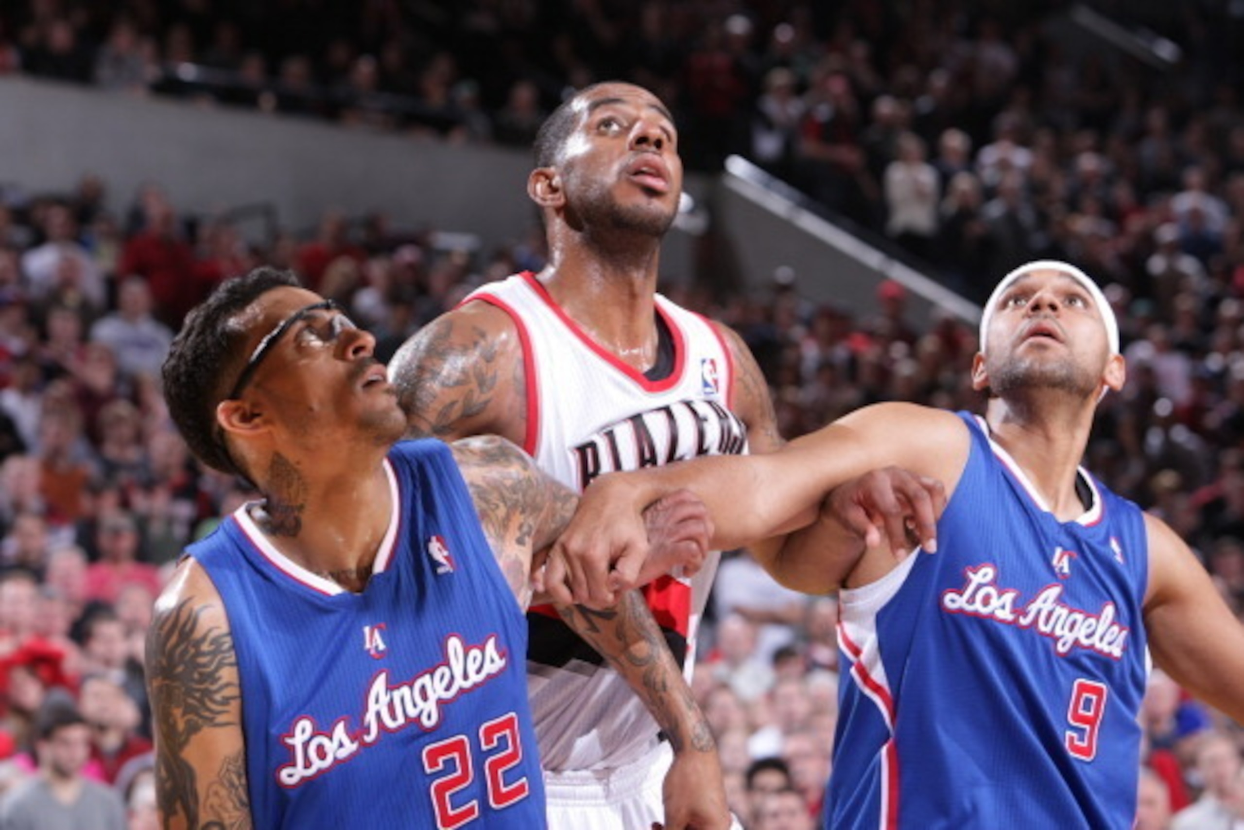 PORTLAND, OR - DECEMBER 26:  Matt Barnes #22 and Jared Dudley #9 of the Los Angeles Clippers box out LaMarcus Aldridge #12 of the Portland Trail Blazers on December 26, 2013 at the Moda Center Arena in Portland, Oregon. NOTE TO USER: User expressly acknow