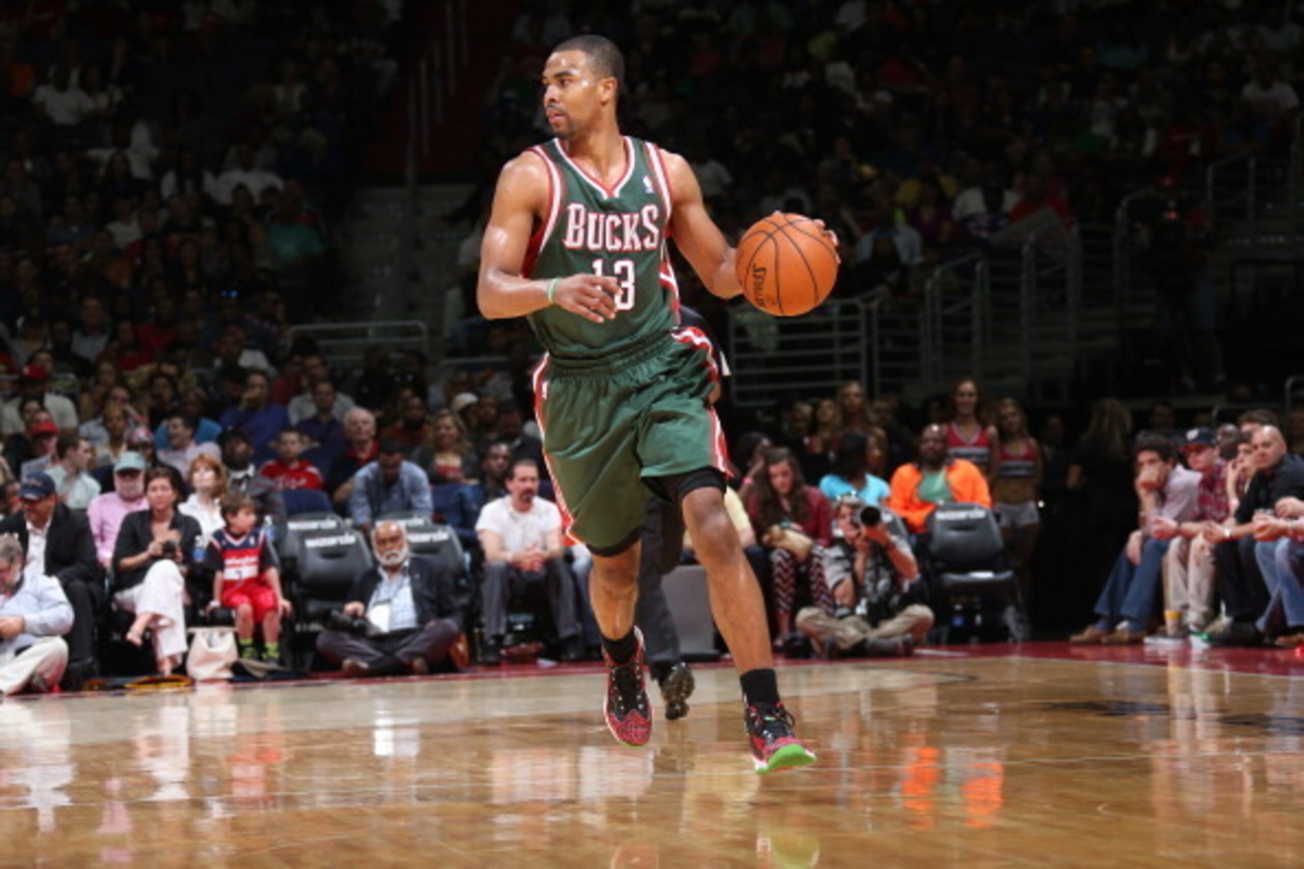 WASHINGTON, DC - APRIL 12: Ramon Sessions #13 of the Milwaukee Bucks moves the ball up-court against the Washington Wizards at the Verizon Center on April 12, 2014 in Washington, DC. NOTE TO USER: User expressly acknowledges and agrees that, by downloadin