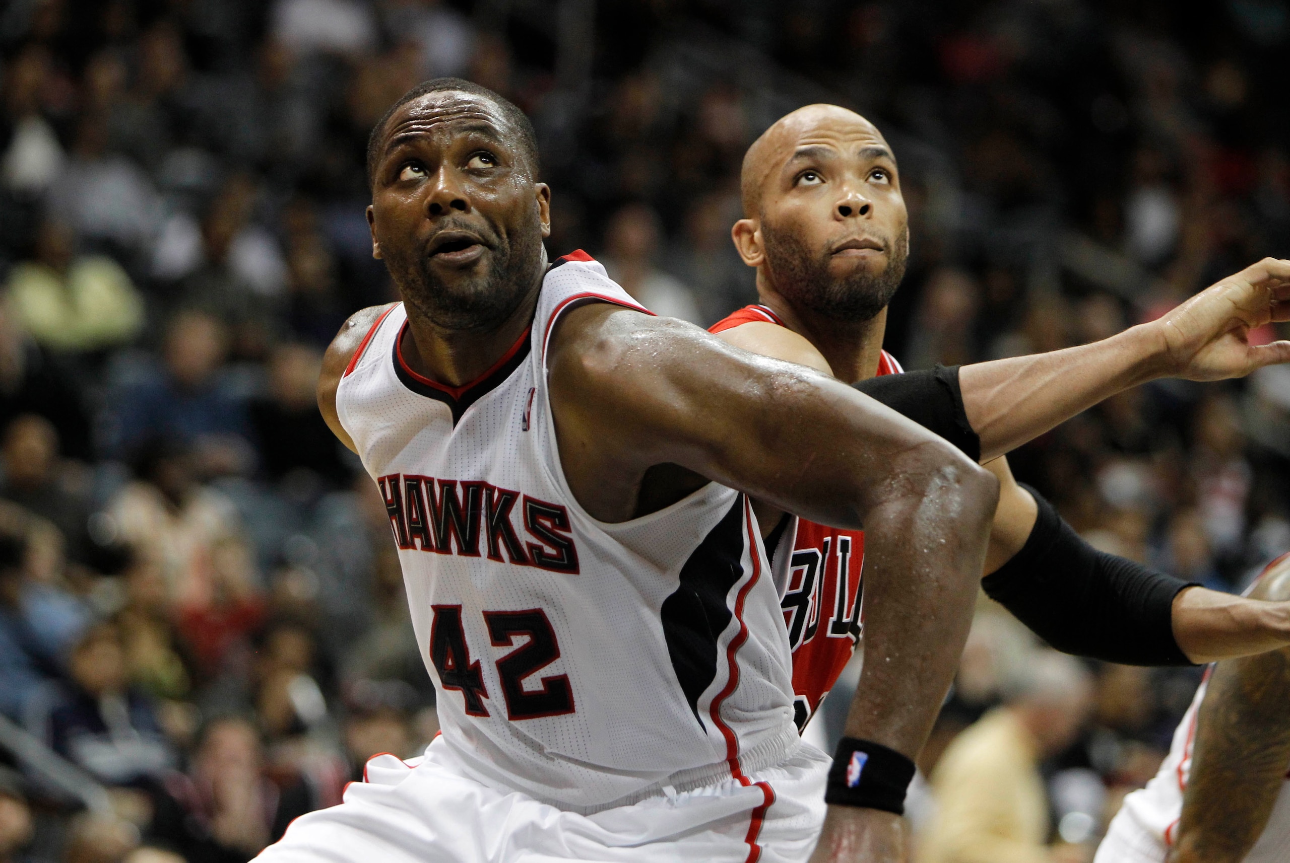 Feb 25, 2014; Atlanta, GA, USA; Atlanta Hawks power forward Elton Brand (42) and Chicago Bulls power forward Taj Gibson (22) fight for a rebound in the second quarter at Philips Arena. Mandatory Credit: Brett Davis-USA TODAY Sports