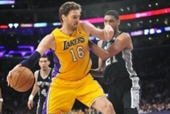 March 19, 2014; Los Angeles, CA, USA; Los Angeles Lakers center Pau Gasol (16) moves to the basket against the San Antonio Spurs during the first half at Staples Center. Mandatory Credit: Gary A. Vasquez-USA TODAY Sports