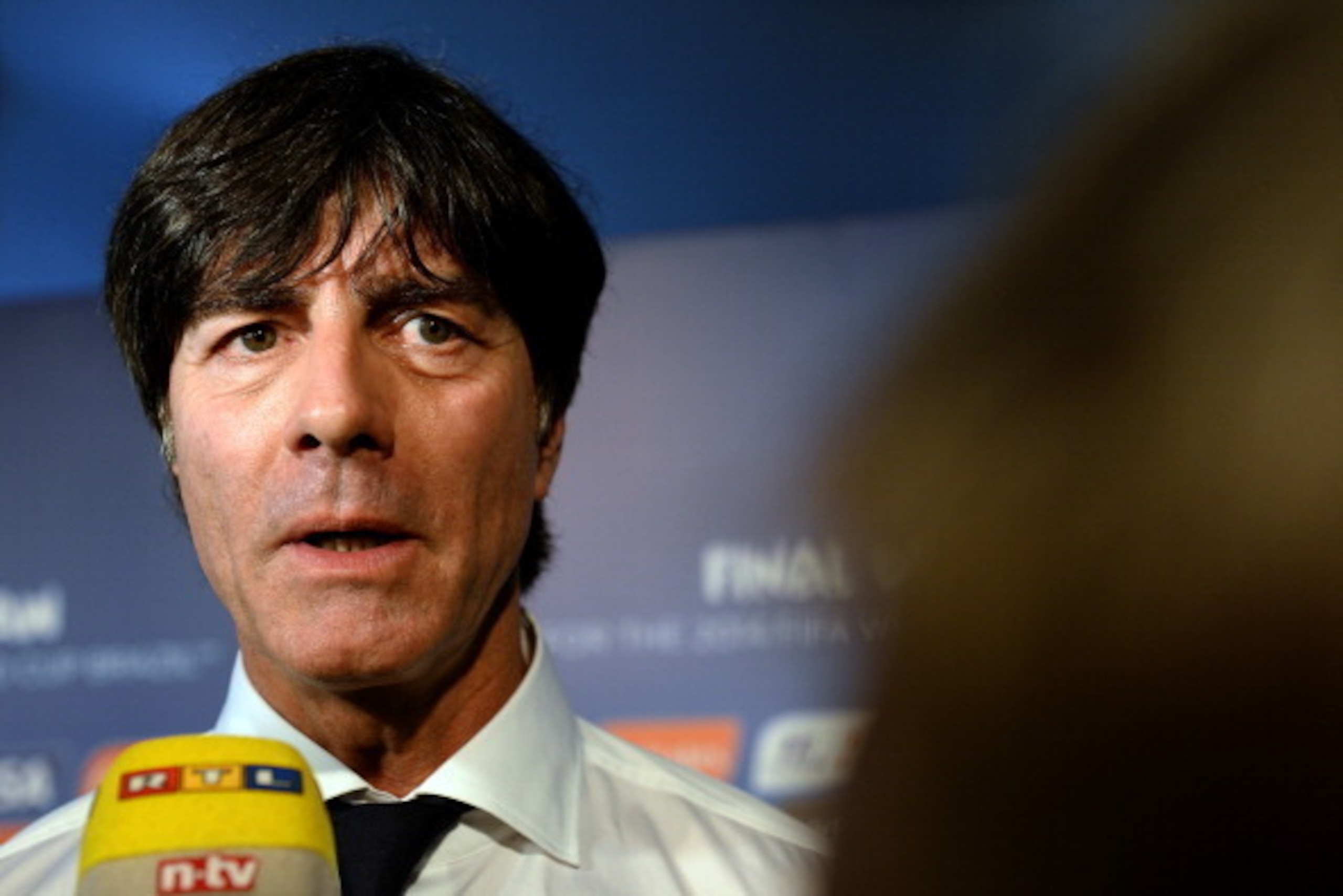 COSTA DO SAUIPE, BRAZIL - DECEMBER 06:  Germany coach Joachim Loew speaks to members of the media after the Final Draw for the 2014 FIFA World Cup Brazil at Costa do Sauipe Resort on December 6, 2013 in Costa do Sauipe, Bahia, Brazil.  (Photo by Buda Mend
