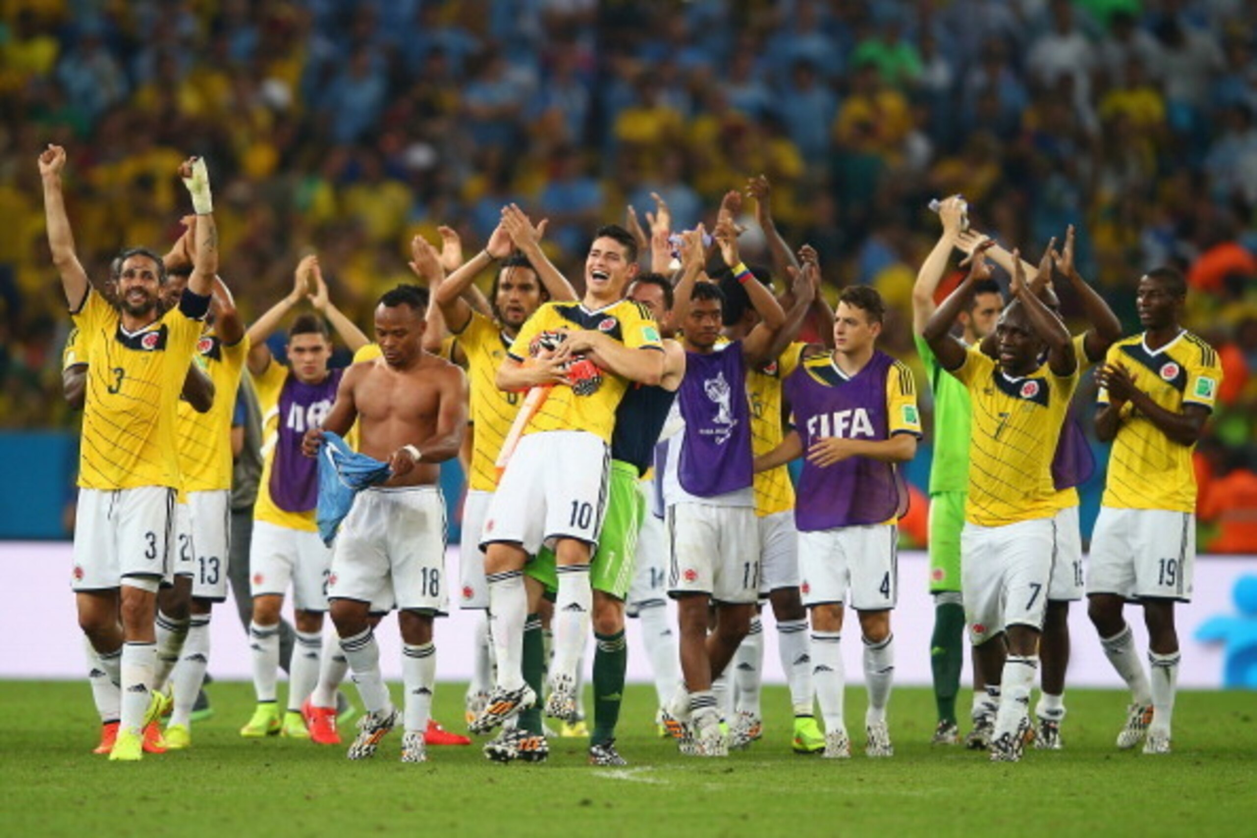 RIO DE JANEIRO, BRAZIL - JUNE 28: James Rodriguez of Colombia is picked up by goalkeeper David Ospina in celebration after defeating Uruguay 2-0 during the 2014 FIFA World Cup Brazil round of 16 match between Colombia and Uruguay at Maracana on June 28, 2