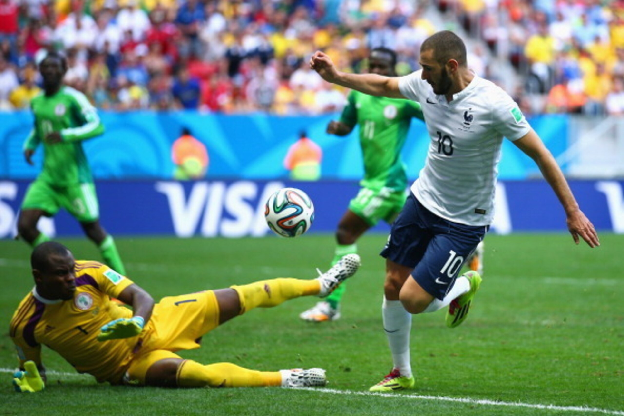 BRASILIA, BRAZIL - JUNE 30: Karim Benzema of France shoots against Vincent Enyeama of Nigeria during the 2014 FIFA World Cup Brazil Round of 16 match between France and Nigeria at Estadio Nacional on June 30, 2014 in Brasilia, Brazil.  (Photo by Paul Gilh