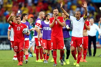 MANAUS, BRAZIL - JUNE 25:  (L-R) Xherdan Shaqiri, Haris Seferovic and Gokhan Inler of Switzerland acknowledge the fans after a 3-0 victory over Honduras in the 2014 FIFA World Cup Brazil Group E match between Honduras and Switzerland at Arena Amazonia on 