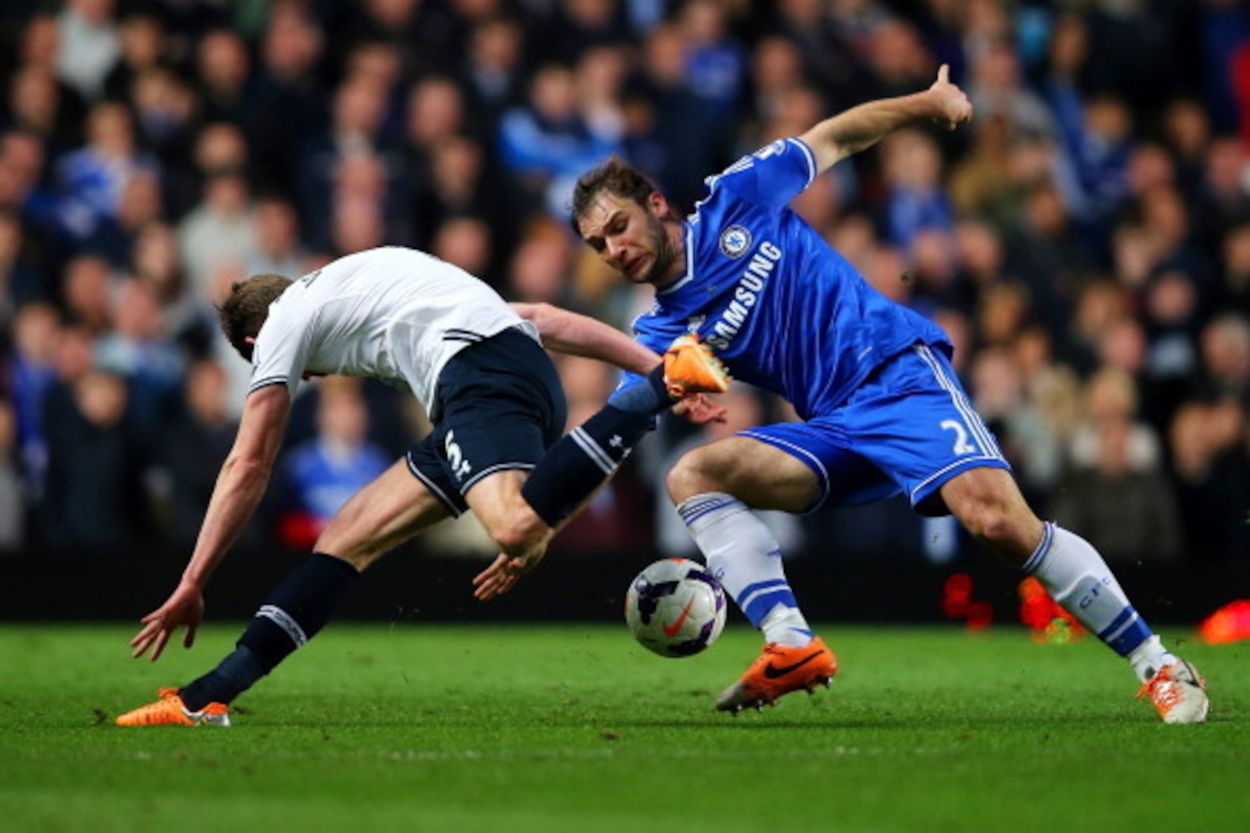 LONDON, ENGLAND - MARCH 08:  Jan Vertonghen of Spurs is challenged by Branislav Ivanovic of Chelsea during the Barclays Premier League match between Chelsea and Tottenham Hotspur at Stamford Bridge on March 8, 2014 in London, England.  (Photo by Clive Ros
