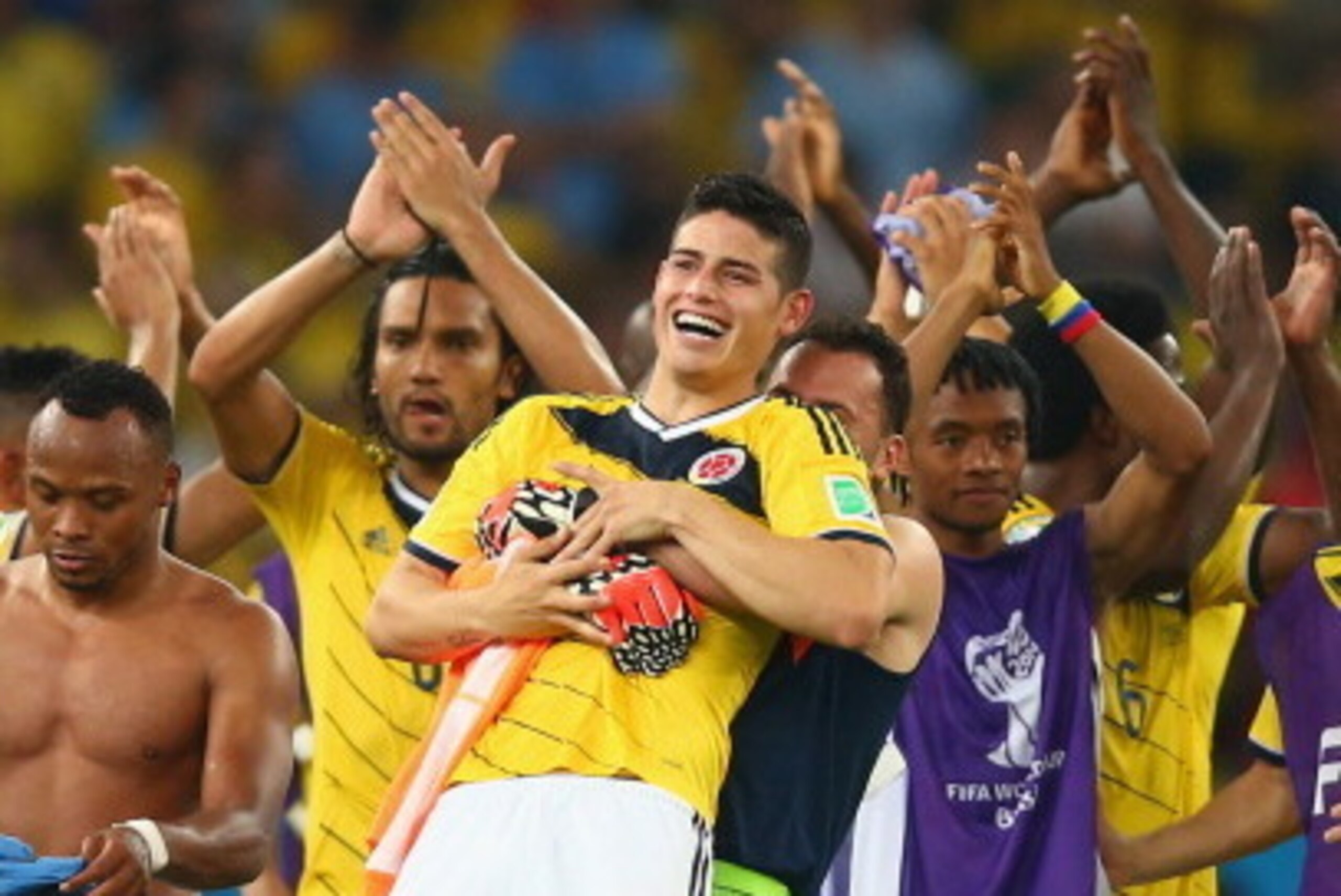 RIO DE JANEIRO, BRAZIL - JUNE 28:  James Rodriguez of Colombia is picked up by goalkeeper David Ospina in celebration after defeating Uruguay 2-0 during the 2014 FIFA World Cup Brazil round of 16 match between Colombia and Uruguay at Maracana on June 28, 