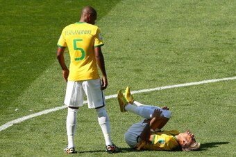 BELO HORIZONTE, BRAZIL - JUNE 28:  Neymar reacts as Fernandinho of Brazil stands over during the 2014 FIFA World Cup Brazil round of 16 match between Brazil and Chile at Estadio Mineirao on June 28, 2014 in Belo Horizonte, Brazil.  (Photo by Ian Walton/Ge