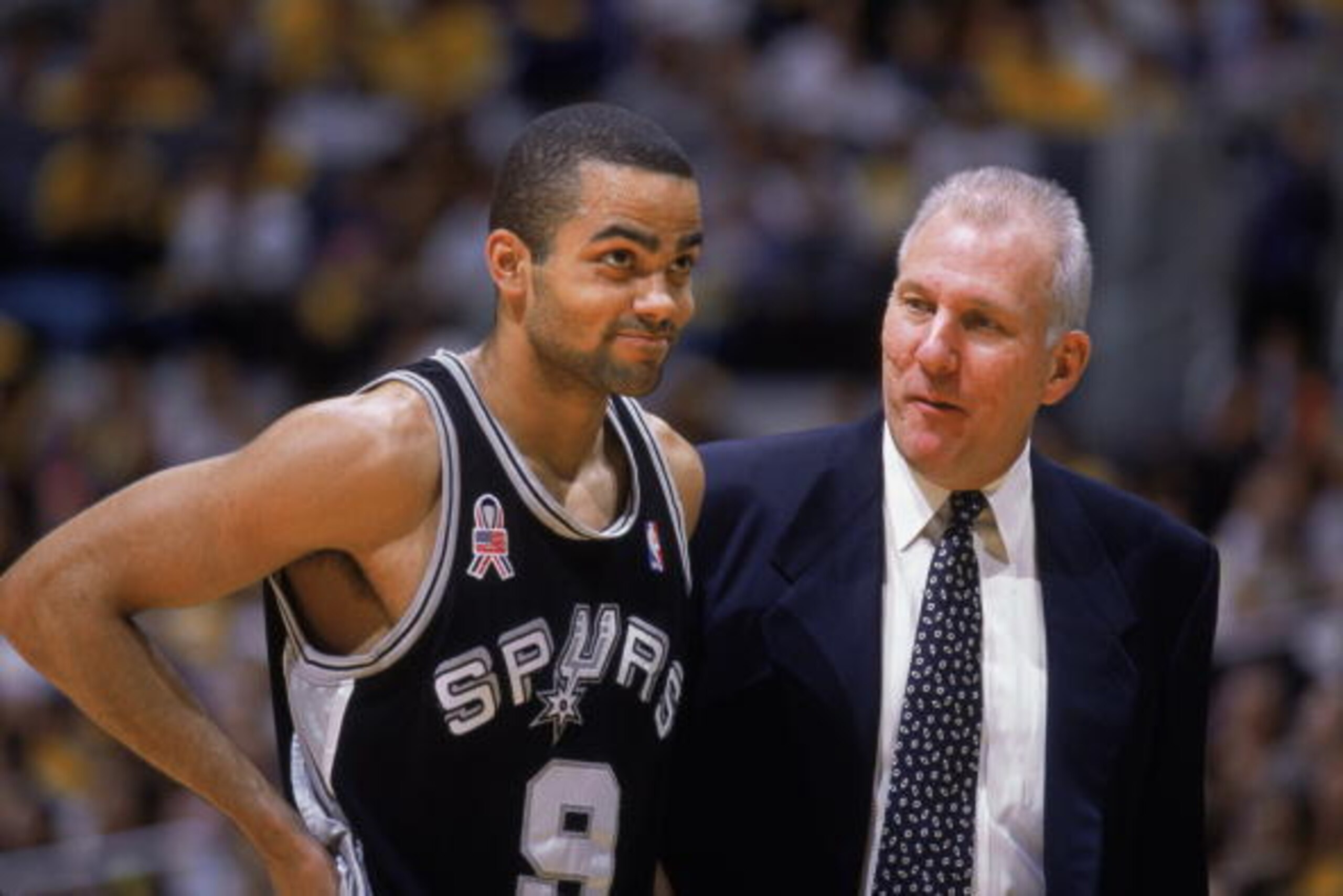 LOS ANGELES - MAY 5:  Tony Parker #9 of the San Antonio Spurs talks to his head coach Gregg Popovich, during game 1 of the Western Conference Semifinals during the 2002 NBA Playoffs against the Los Angeles Lakers at the Staples Center, in Los Angeles, Cal