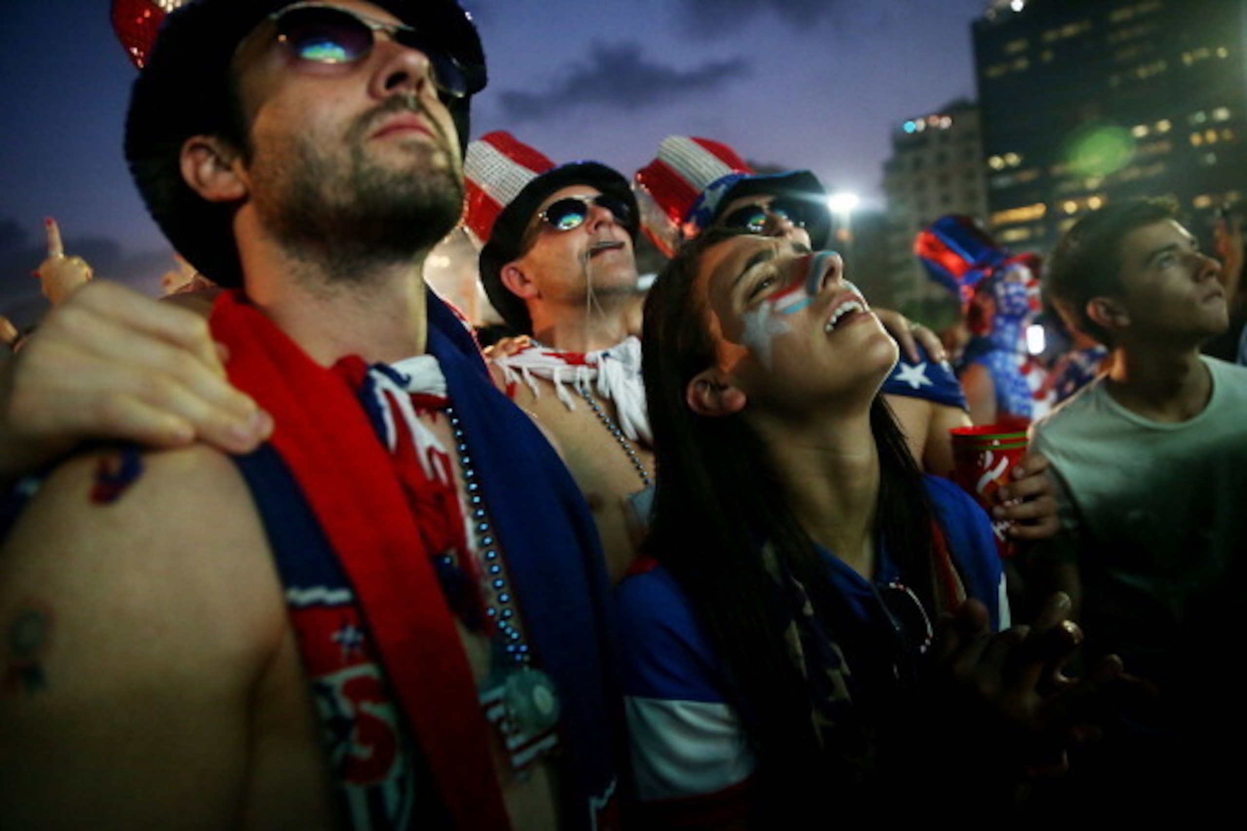 RIO DE JANEIRO, BRAZIL - JULY 01:  U.S. fans watch the first half of their match against Belgium at FIFA Fan Fest on Copacabana Beach during the 2014 FIFA World Cup on July 1, 2014 in Rio de Janeiro, Brazil. The U.S. went on to lose the match in extra tim