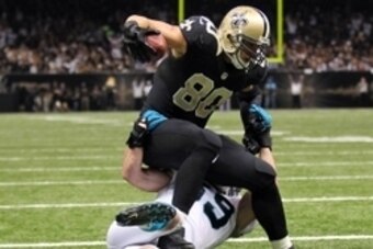 Dec 8, 2013; New Orleans, LA, USA; New Orleans Saints tight end Jimmy Graham (80) is tackled by Carolina Panthers middle linebacker Luke Kuechly (59) as he carries the ball into the end zone for a touchdown in the second quarter at Mercedes-Benz Superdome