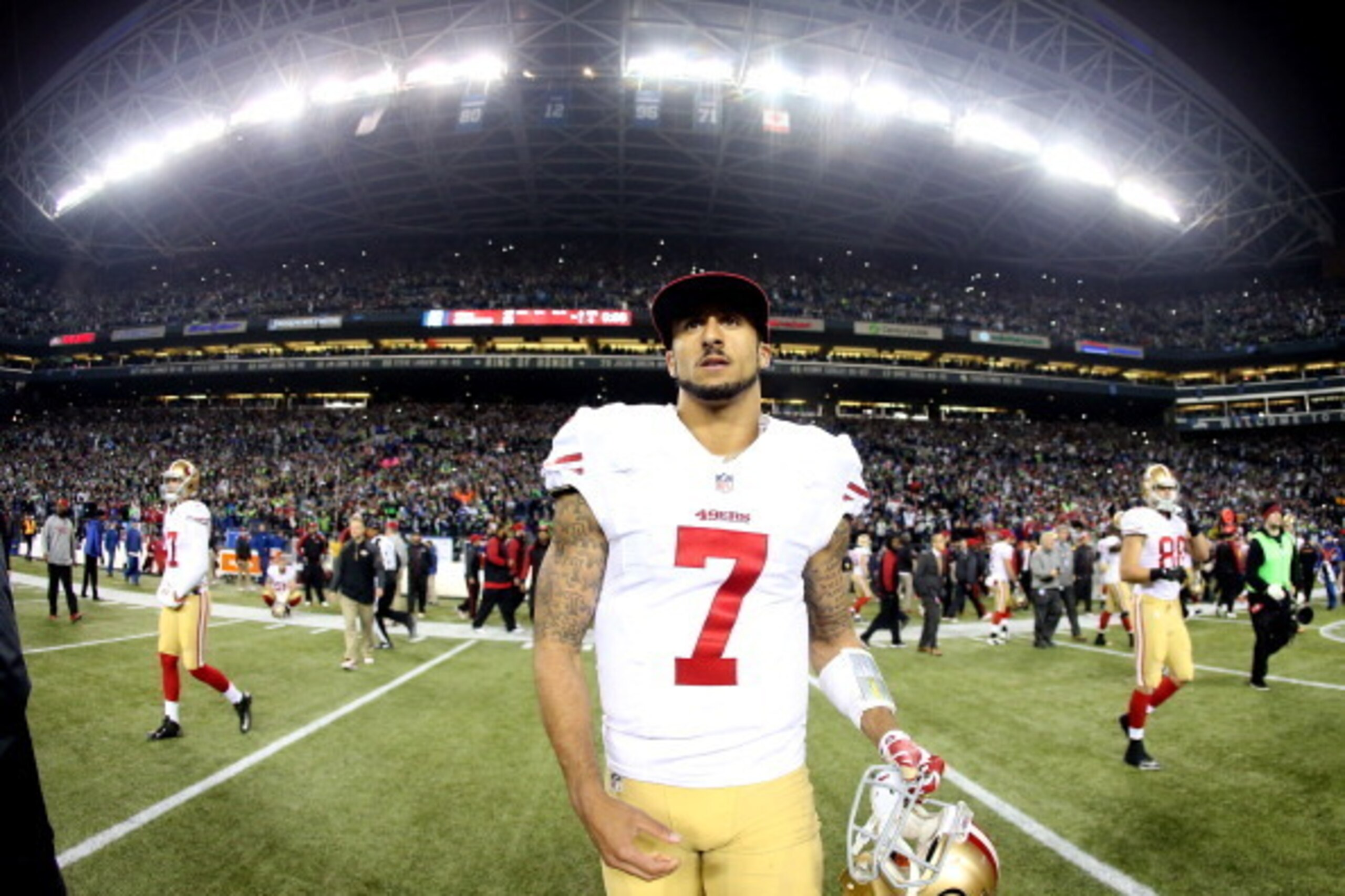 SEATTLE, WA - JANUARY 19:  Quarterback Colin Kaepernick #7 of the San Francisco 49ers walks off the field after losing to the Seattle Seahawks 23-17 during the 2014 NFC Championship at CenturyLink Field on January 19, 2014 in Seattle, Washington.  (Photo 