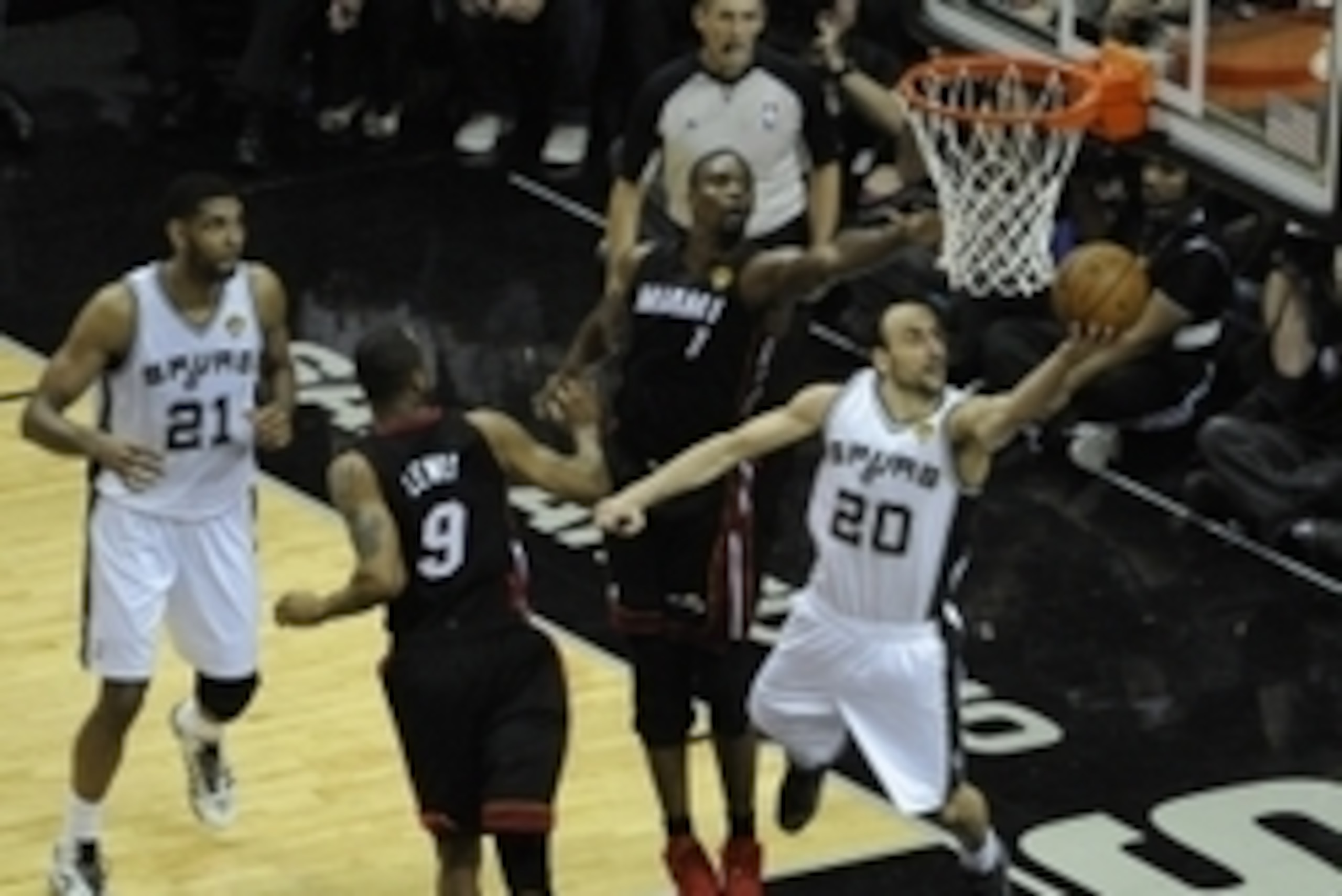 Jun 15, 2014; San Antonio, TX, USA; San Antonio Spurs guard Manu Ginobili (20) shoots against Miami Heat forward Chris Bosh (1) in game five of the 2014 NBA Finals at AT&T Center. Mandatory Credit: Brendan Maloney-USA TODAY Sports