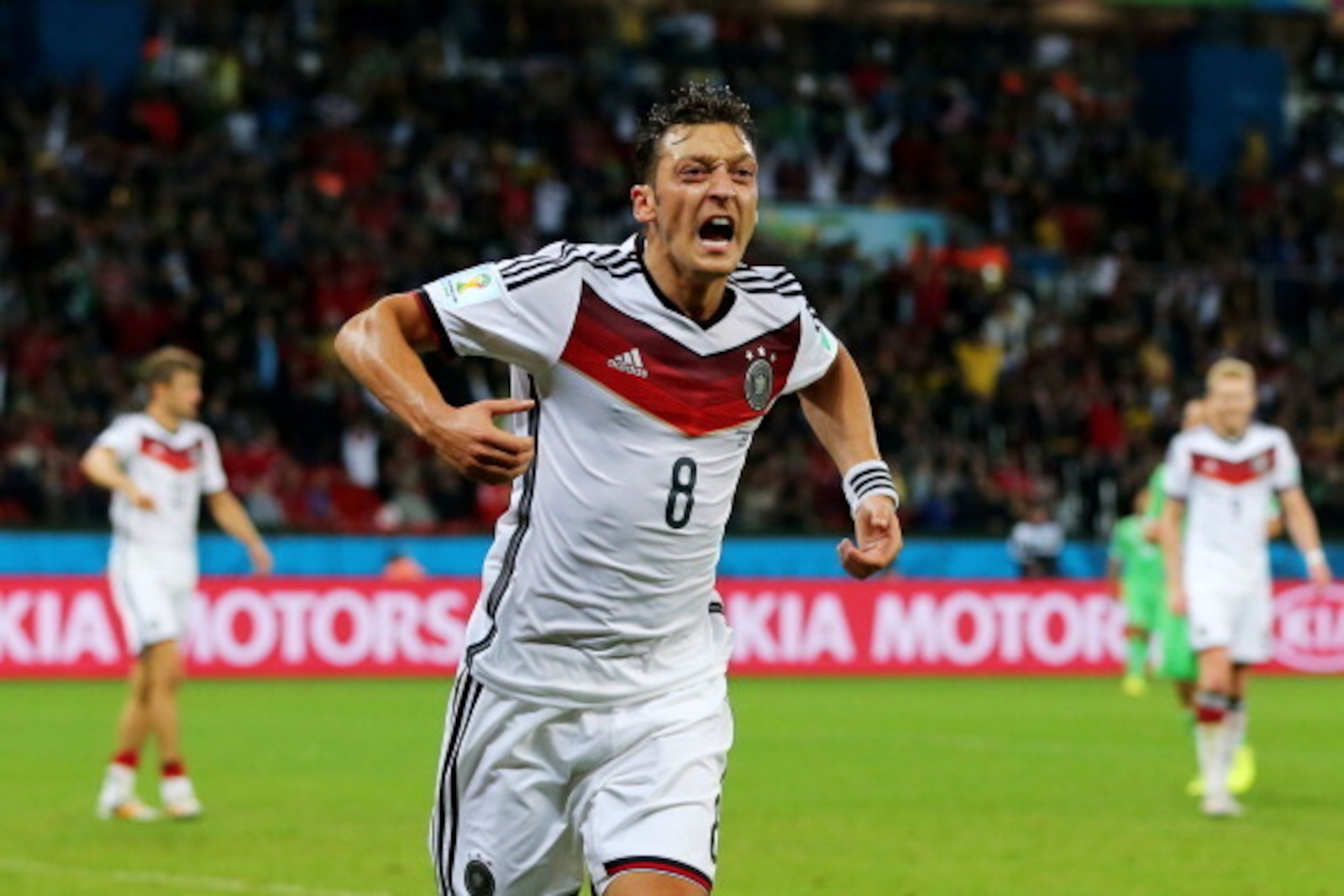 PORTO ALEGRE, BRAZIL - JUNE 30:  Mesut Oezil of Germany celebrates scoring his team's second goal in extra time during the 2014 FIFA World Cup Brazil Round of 16 match between Germany and Algeria at Estadio Beira-Rio on June 30, 2014 in Porto Alegre, Braz