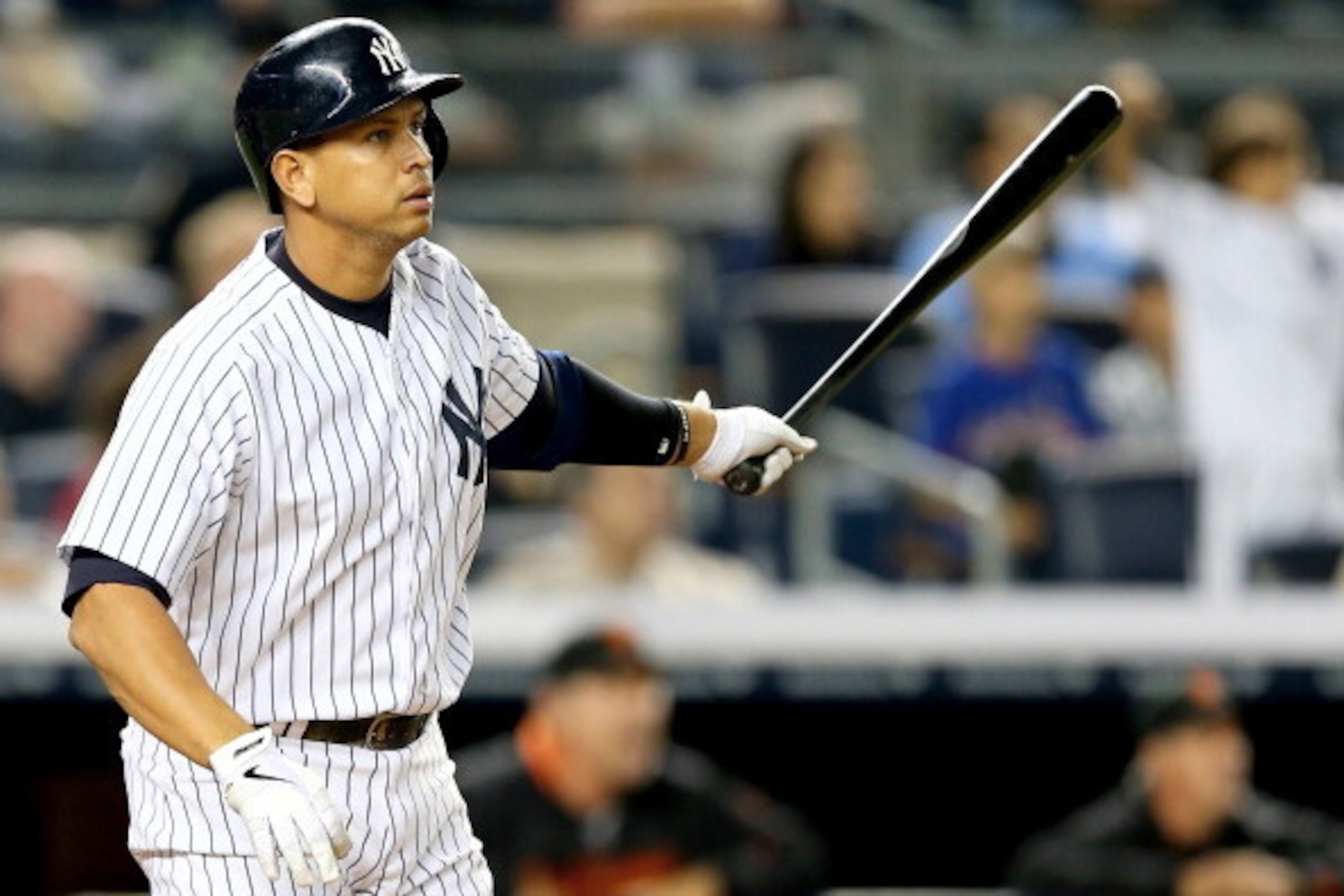 NEW YORK, NY - SEPTEMBER 20:  Alex Rodriguez #13 of the New York Yankees watches his hit fly out of the park and turn into a grand slam in the seventh inning against the San Francisco Giants during interleague  play on September 20, 2013 at Yankee Stadium