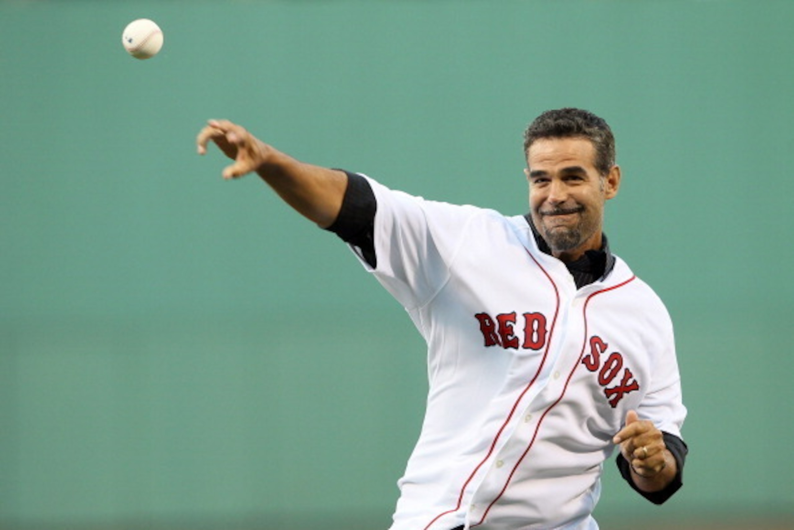 BOSTON, MA - JULY 23:  Mike Lowell, former Red Sox third baseman, throws out a ceremonial first pitch before the game against the Seattle Mariners on July 23, 2011 at Fenway Park in Boston, Massachusetts.  (Photo by Elsa/Getty Images)