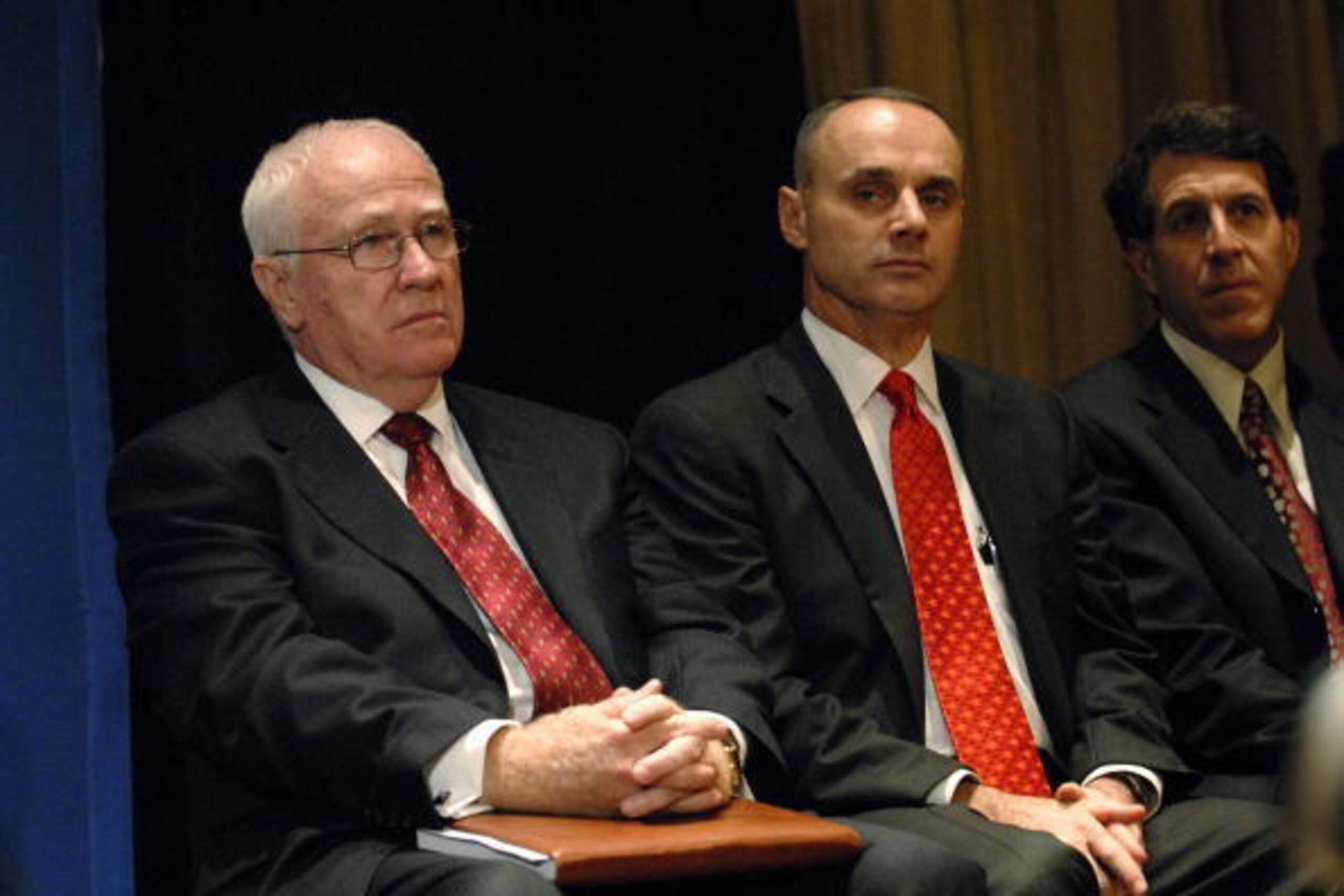 NEW YORK - DECEMBER 13:  (L-R)  Major League Baseball (MLB) President Bob DuPuy, MLB executive vice president Robert Manfred and Dr. Gary Green listen as Commissioner Bud Selig speaks at a news conference December 13, 2007 at the Waldorf-Astoria in New Yo