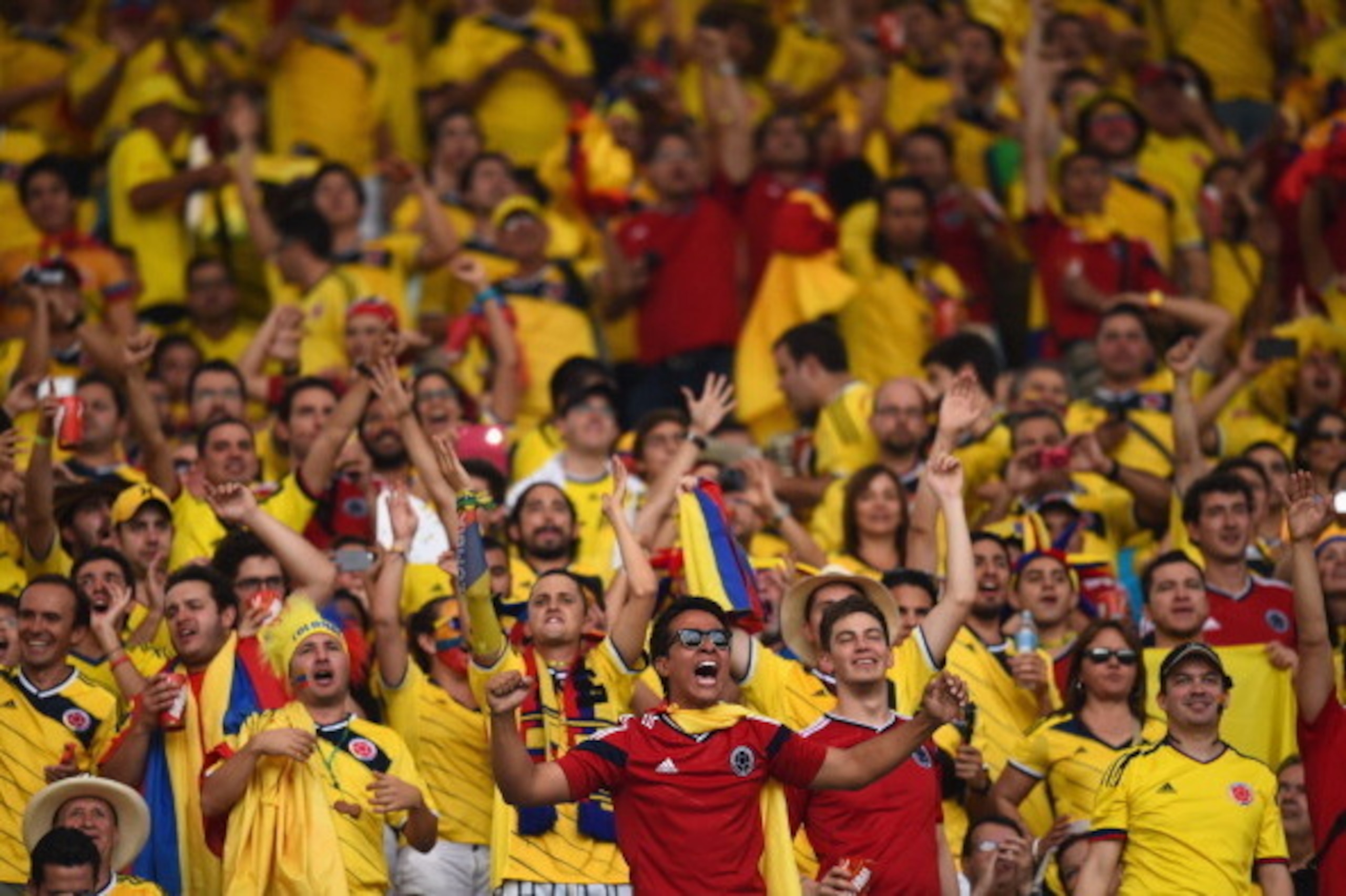 RIO DE JANEIRO, BRAZIL - JUNE 28: Colombia fans enjoy the atmosphere prior to the 2014 FIFA World Cup Brazil round of 16 match between Colombia and Uruguay at Maracana on June 28, 2014 in Rio de Janeiro, Brazil.  (Photo by Matthias Hangst/Getty Images)