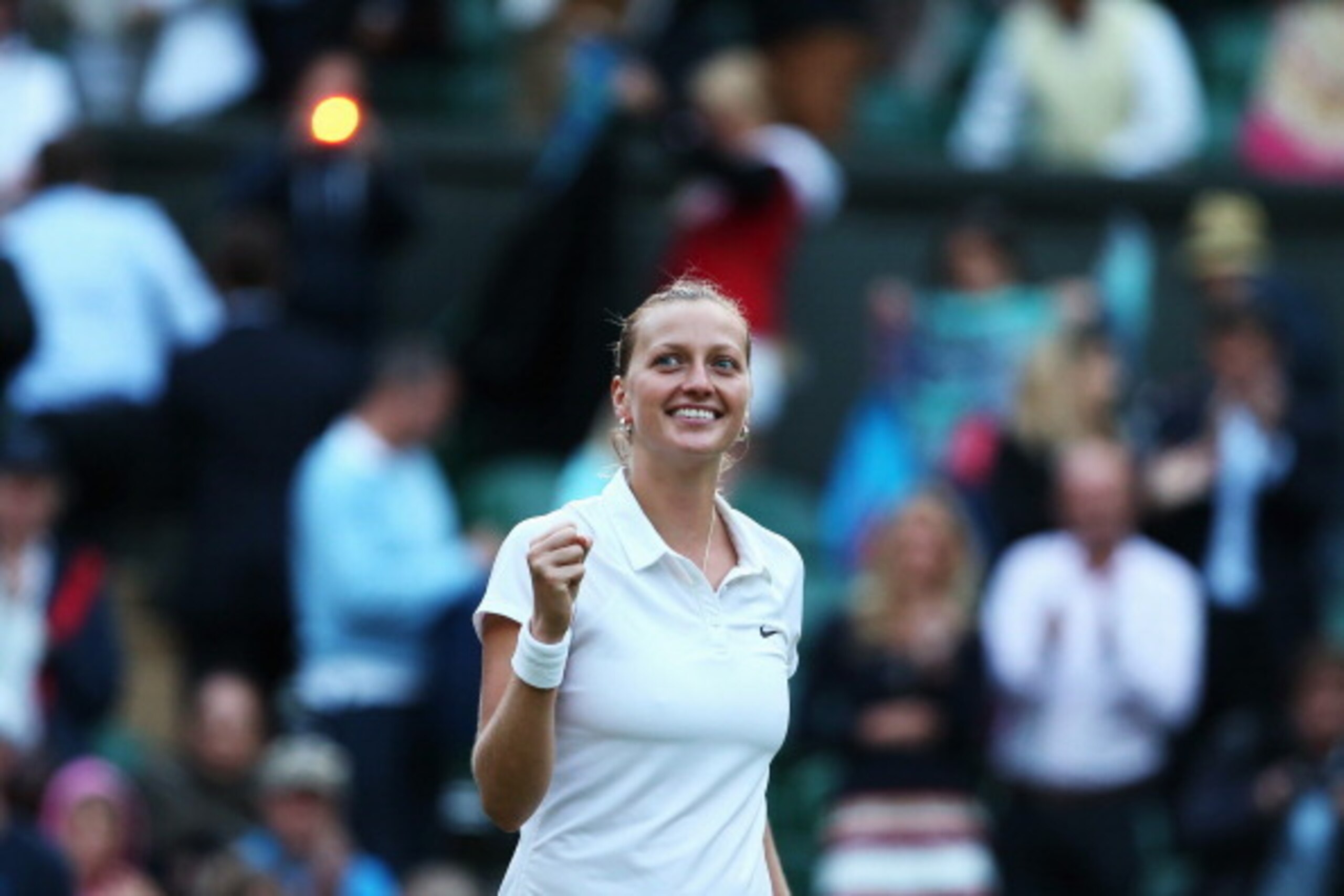 LONDON, ENGLAND - JULY 01:  Petra Kvitova of Czech Republic celebrates winning her Ladies' Singles quarter-final match against Barbora Zahlavova Strycova of Czech Republic on day eight of the Wimbledon Lawn Tennis Championships at the All England Lawn Ten