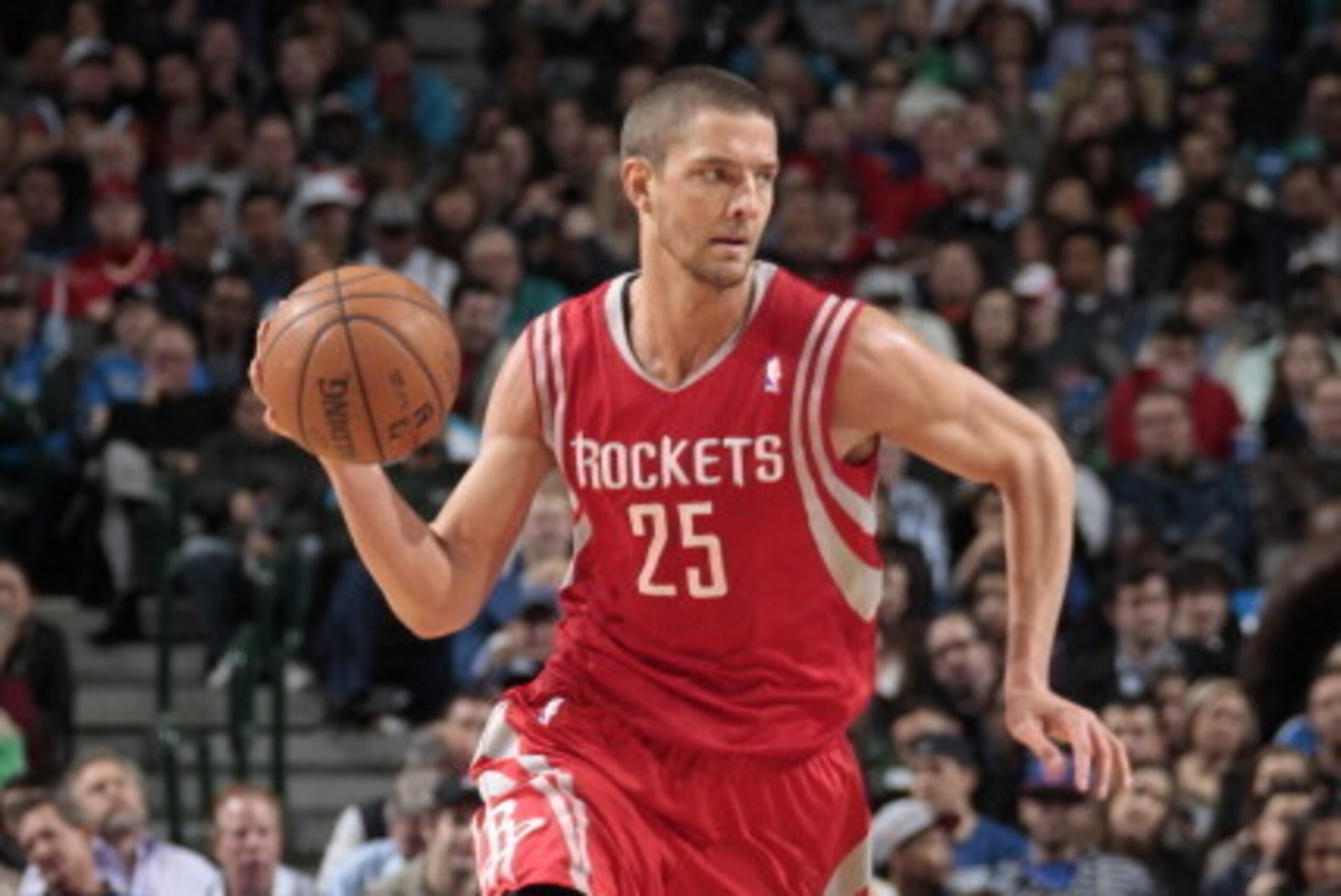DALLAS, TX - JANUARY 29: Chandler Parsons #25 of the Houston Rockets handles the ball against the Dallas Mavericks on January 29, 2014 at the American Airlines Center in Dallas, Texas. NOTE TO USER: User expressly acknowledges and agrees that, by download