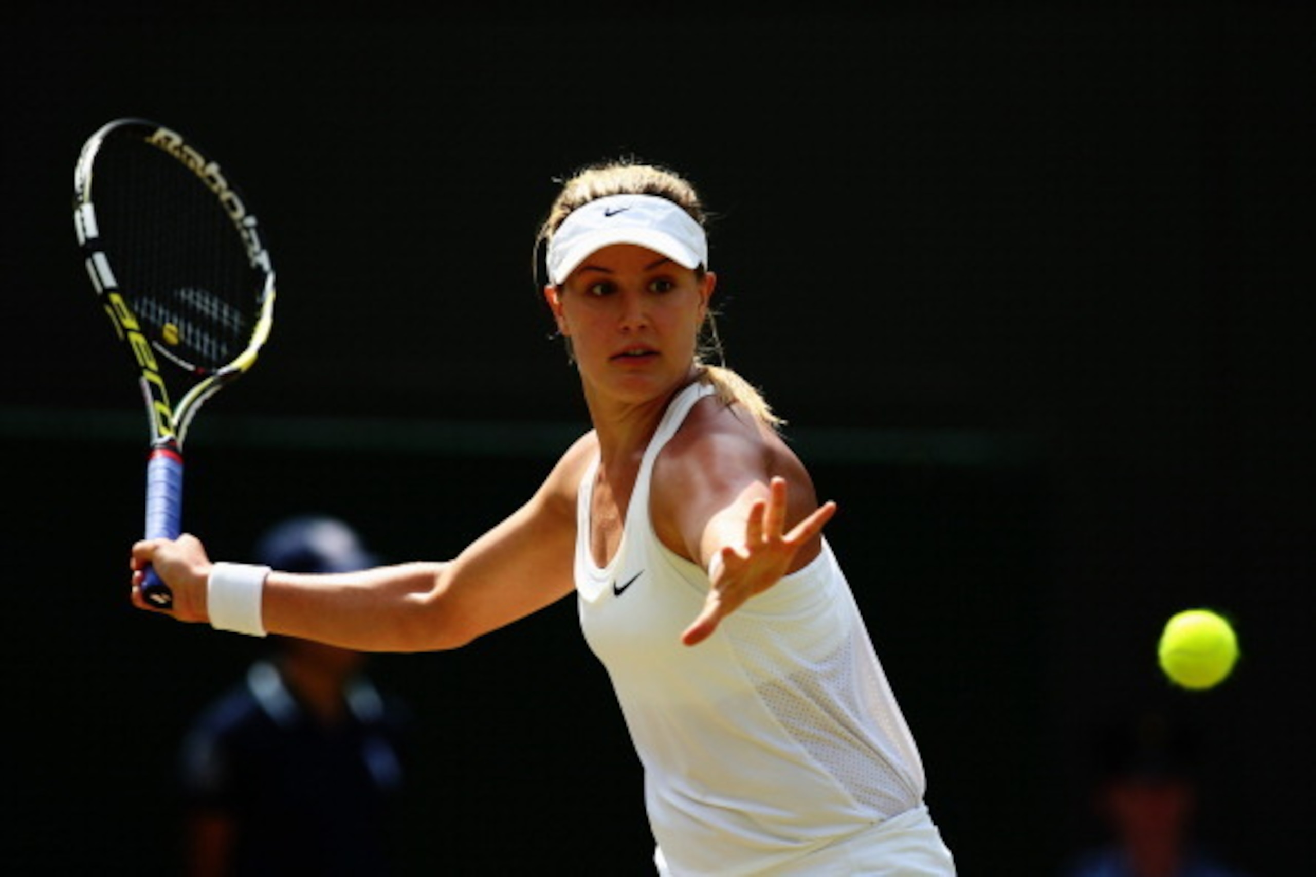 LONDON, ENGLAND - JULY 02:  Eugenie Bouchard of Canada plays a forehand return during her Ladies' Singles quarter-final match against Angelique Kerber of Germany on day nine of the Wimbledon Lawn Tennis Championships at the All England Lawn Tennis and Cro