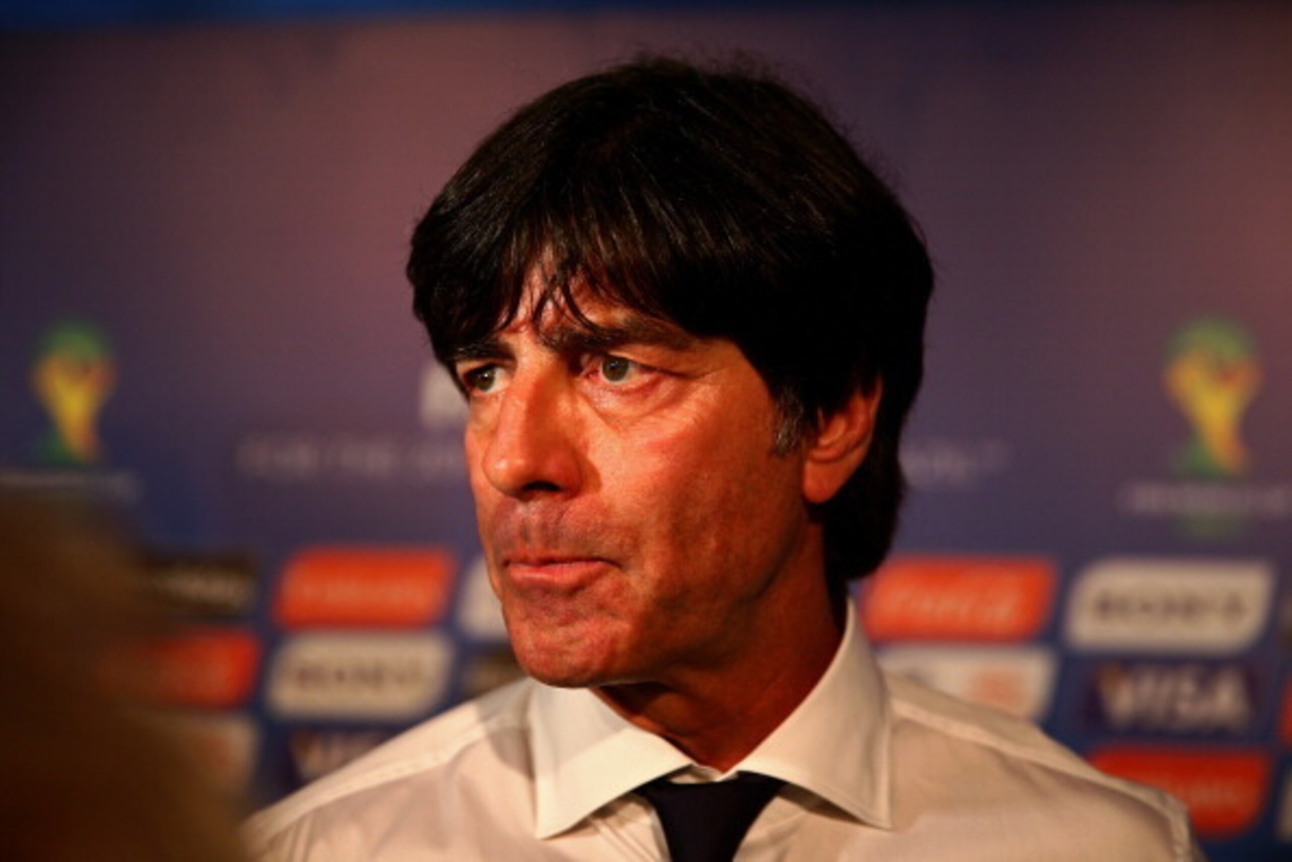COSTA DO SAUIPE, BRAZIL - DECEMBER 06:  Germany coach Joachim Loew speaks to members of the media after the Final Draw for the 2014 FIFA World Cup Brazil at Costa do Sauipe Resort on December 6, 2013 in Costa do Sauipe, Bahia, Brazil.  (Photo by Clive Mas
