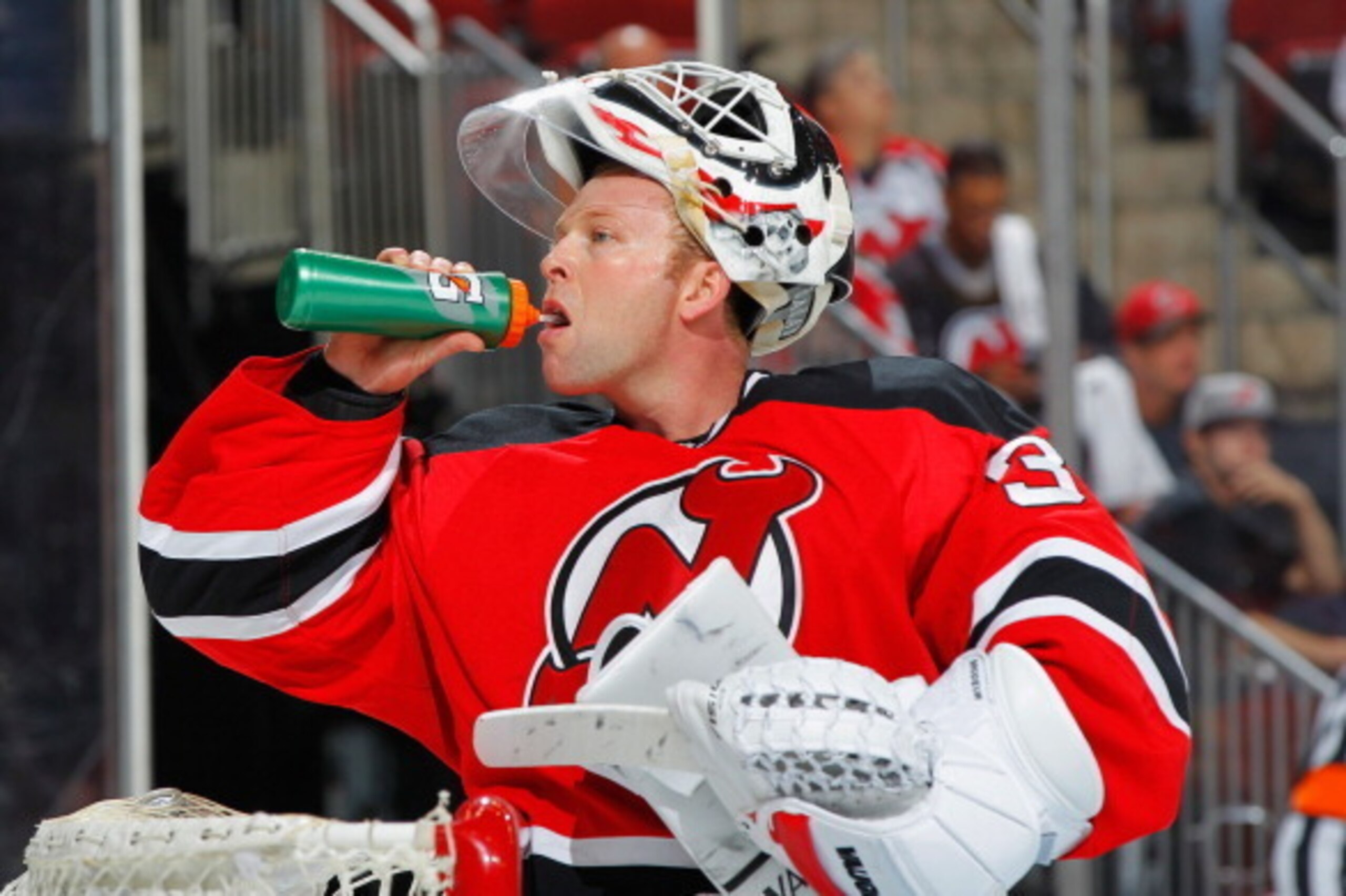 NEWARK, NJ - APRIL 13: Winning goaltender Martin Brodeur #30 of the New Jersey Devils takes a drink during third period against the Boston Bruins at the Prudential Center on April 13, 2014 in Newark, New Jersey. (Photo by Andy Marlin/NHLI via Getty Images