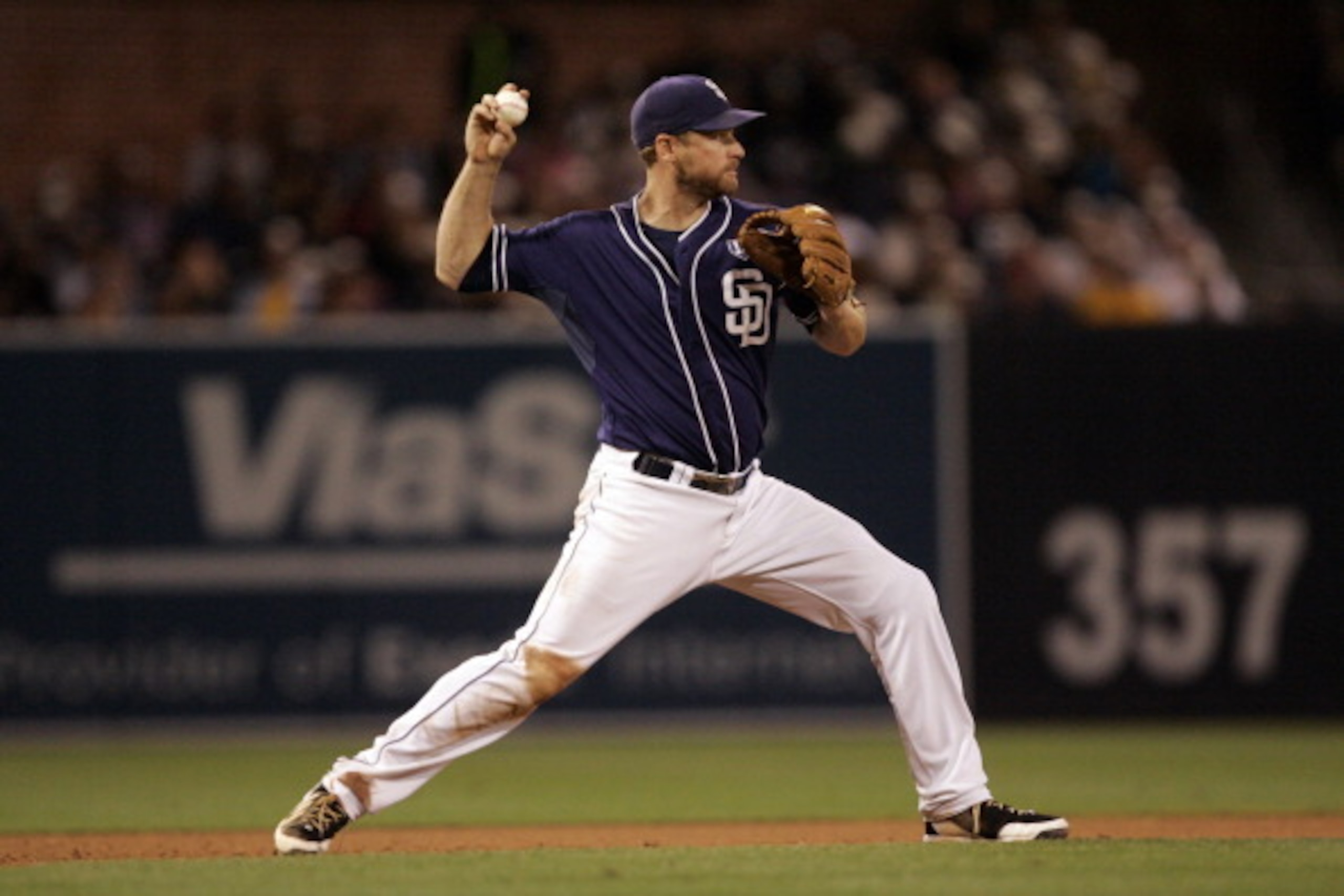 SAN DIEGO, CA - JUNE 28:  Chase Headley #7 of the San Diego Padres throws the ball to second base to start a double play in the 8th inning of the game against the Arizona Diamondbacks at Petco Park on June 28, 2014 in San Diego, California. (Photo by Kent