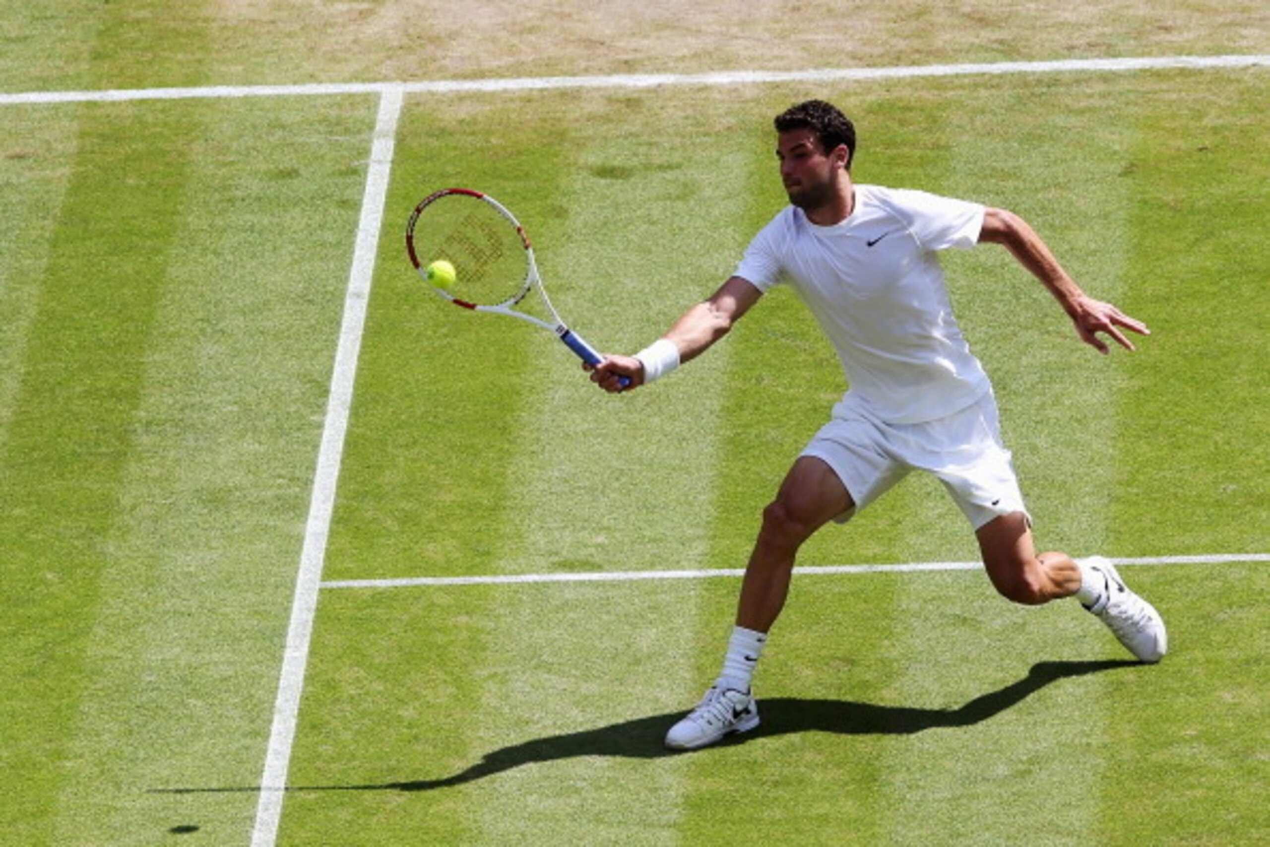 LONDON, ENGLAND - JULY 02:  Grigor Dimitrov of Bulgaria during his Gentlemen's Singles quarter-final match against Andy Murray of Great Britain on day nine of the Wimbledon Lawn Tennis Championships at the All England Lawn Tennis and Croquet Club  at Wimb