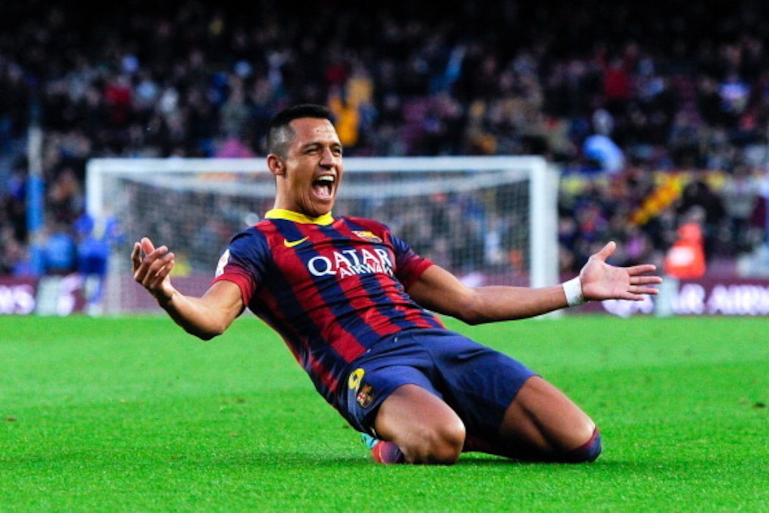 BARCELONA, SPAIN - JANUARY 05:  Alexis Sanchez of FC Barcelona celebrates after scoring his team's fourth goal to complete his hat-trick during the La Liga match between FC Barcelona and Elche FC at Camp Nou on January 5, 2014 in Barcelona, Spain.  (Photo