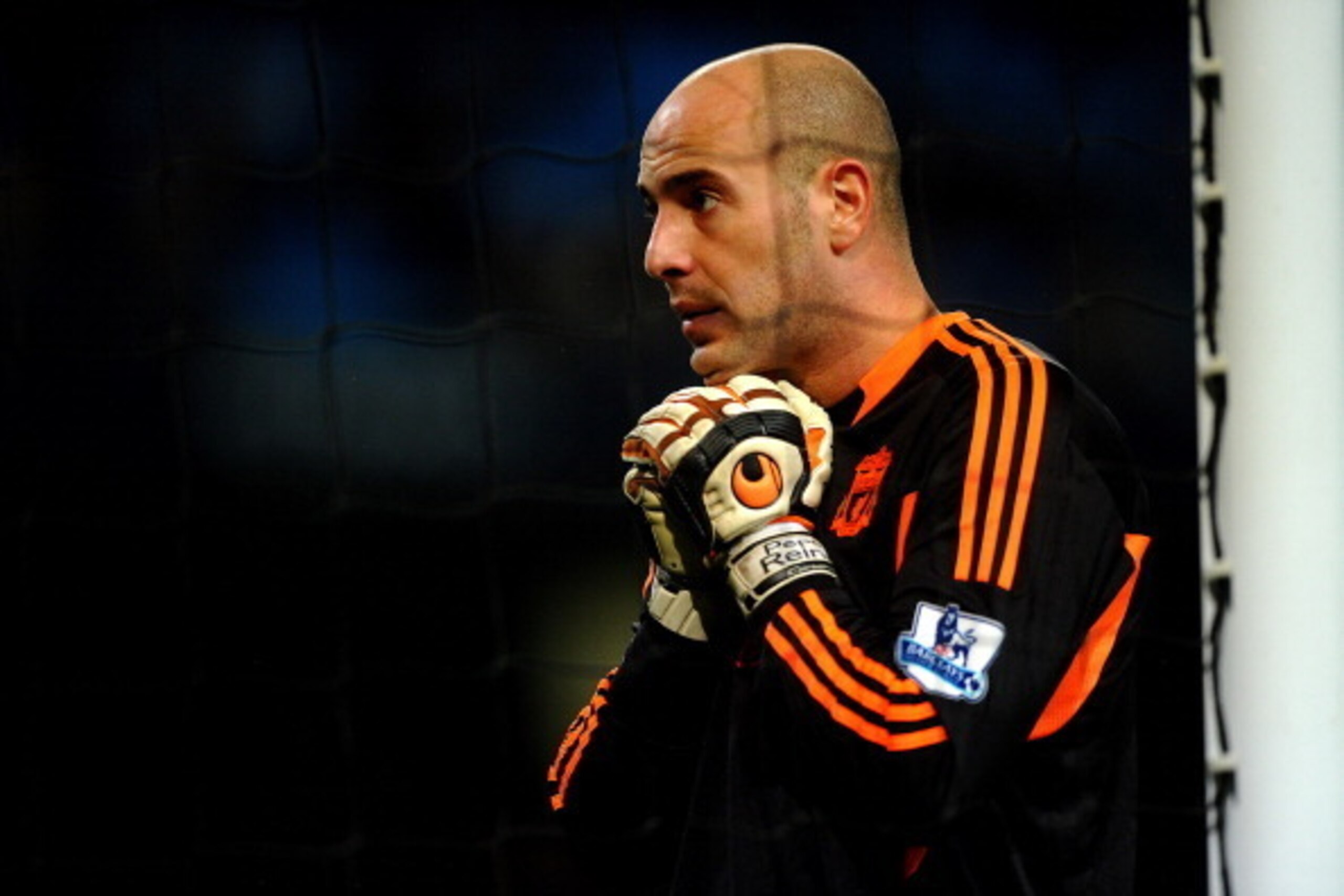 MANCHESTER, ENGLAND - JANUARY 11:  Pepe Reina of Liverpool watches as team mate Steven Gerrard take a penalty kick during the  Carling Cup Semi Final First Leg match between Manchester City and Liverpool at the Etihad Stadium on January 11, 2012 in Manche