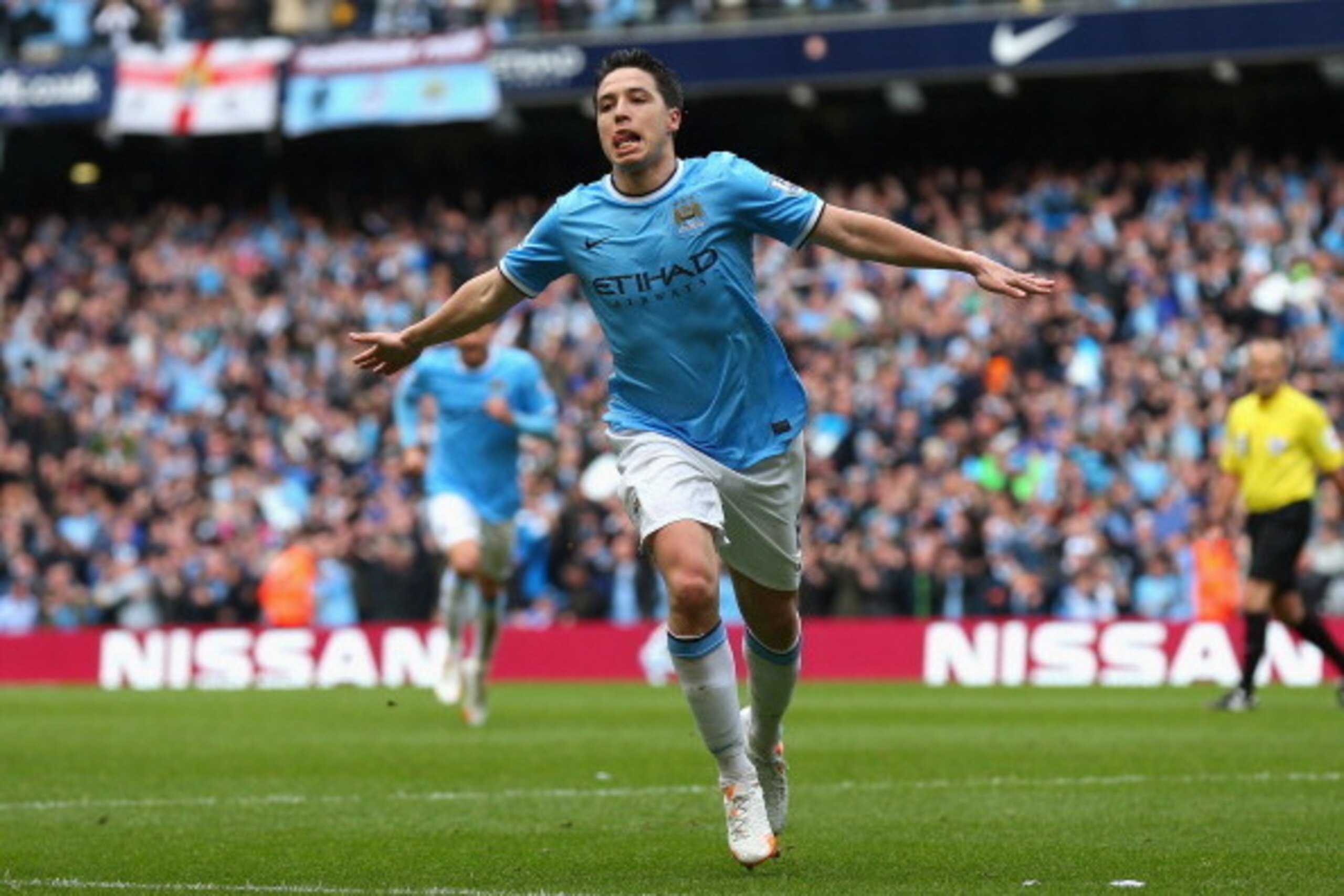 MANCHESTER, ENGLAND - MAY 11:  Samir Nasri of Manchester City celebrates scoring the first goal during the Barclays Premier League match between Manchester City and West Ham United at the Etihad Stadium on May 11, 2014 in Manchester, England.  (Photo by A
