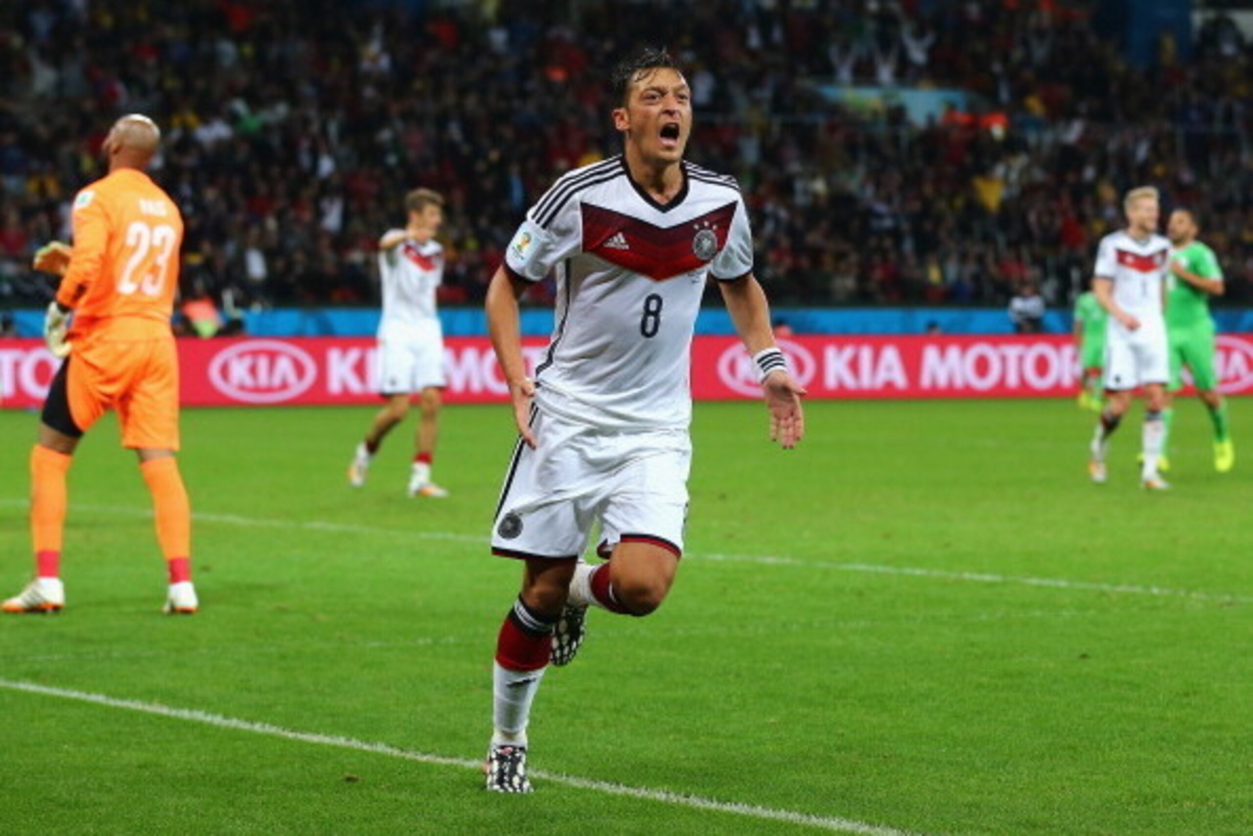 PORTO ALEGRE, BRAZIL - JUNE 30: Mesut Oezil of Germany celebrates scoring his team's second goal in extra time during the 2014 FIFA World Cup Brazil Round of 16 match between Germany and Algeria at Estadio Beira-Rio on June 30, 2014 in Porto Alegre, Braz PORTO ALEGRE, BRAZIL - JUNE 30: Mesut Oezil of Germany celebrates scoring his team's second goal in extra time during the 2014 FIFA World Cup Brazil Round of 16 match between Germany and Algeria at Estadio Beira-Rio on June 30, 2014 in Porto Alegre, Braz