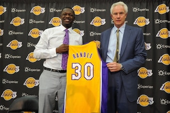 EL SEGUNDO, CA - JUNE 30:  Julius Randle #30 of the Los Angeles Lakers poses for a photo with Los Angeles Lakers General Manager Mitch Kupchak during his introductory press conference on June 30, 2014 at the Toyota Sports Center in El Segundo, California.