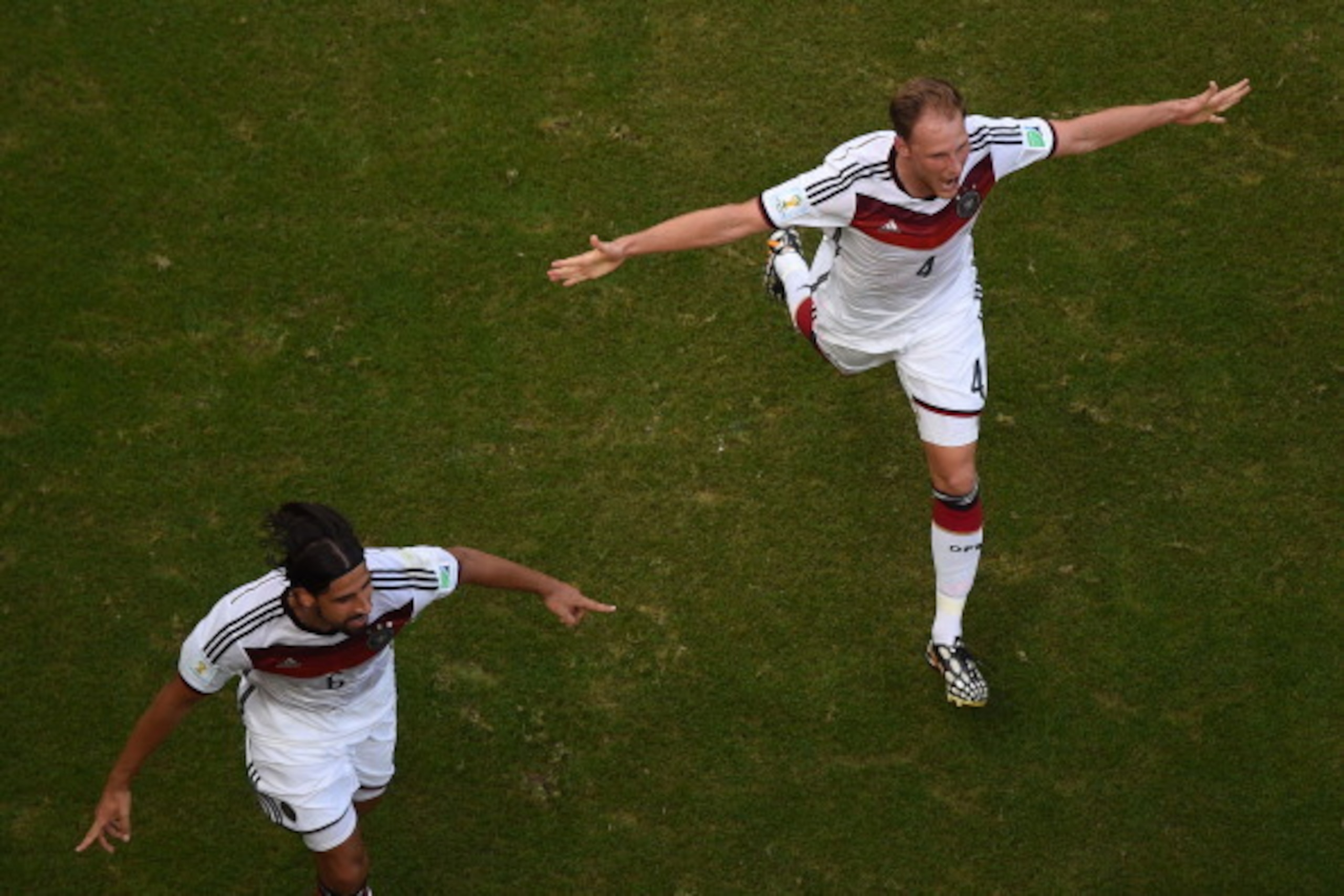 SALVADOR, BRAZIL - JUNE 16: Sami Khedira (L) and Benedikt Hoewedes of Germany celebrate during the 2014 FIFA World Cup Brazil Group G match between Germany and Portugal at Arena Fonte Nova on June 16, 2014 in Salvador, Brazil.  (Photo by Francois Xavier M