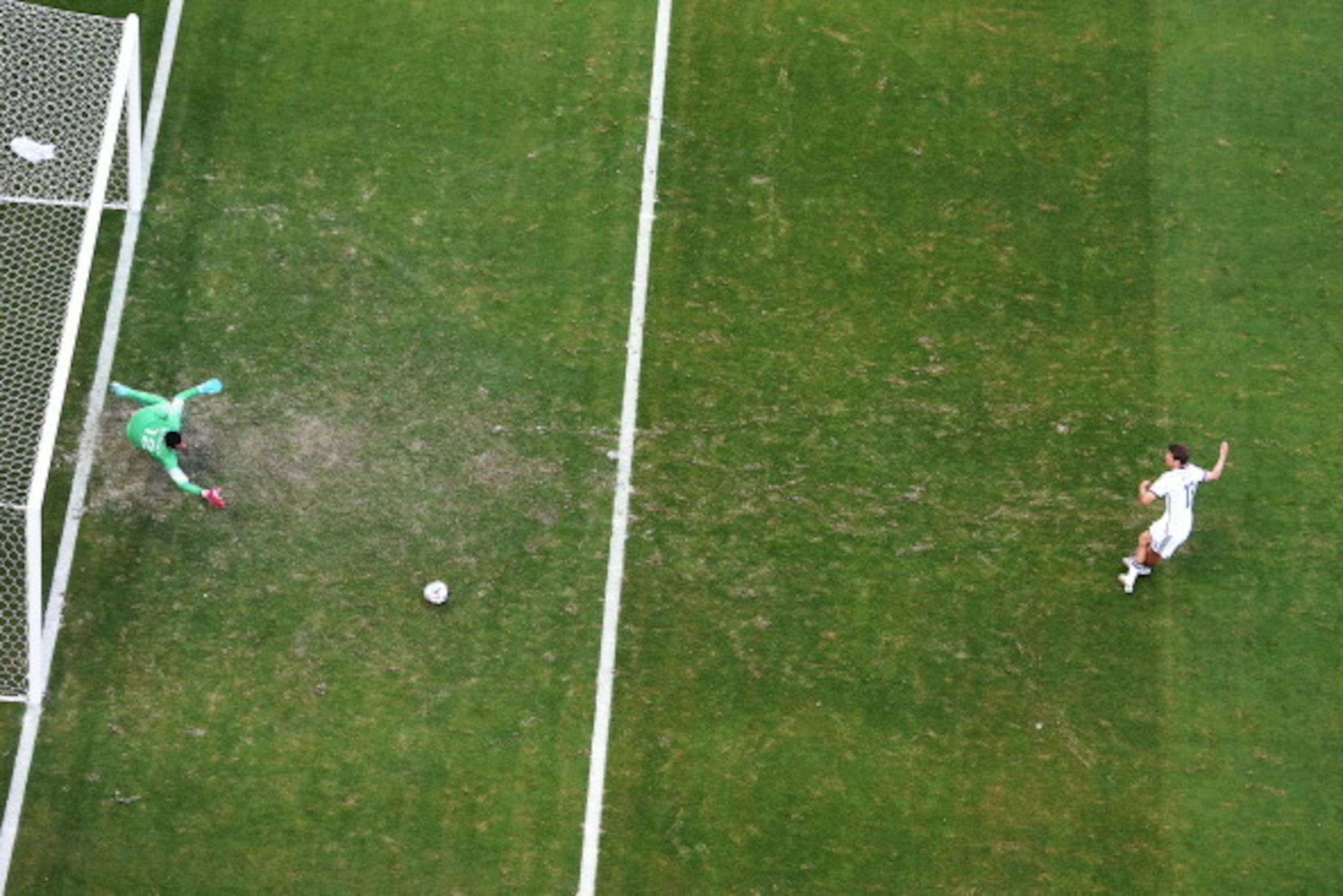 SALVADOR, BRAZIL - JUNE 16:  Thomas Mueller of Germany shoots and scores his team's first goal on a penalty kick past Rui Patricio of Portugal during the 2014 FIFA World Cup Brazil Group G match between Germany and Portugal at Arena Fonte Nova on June 16,