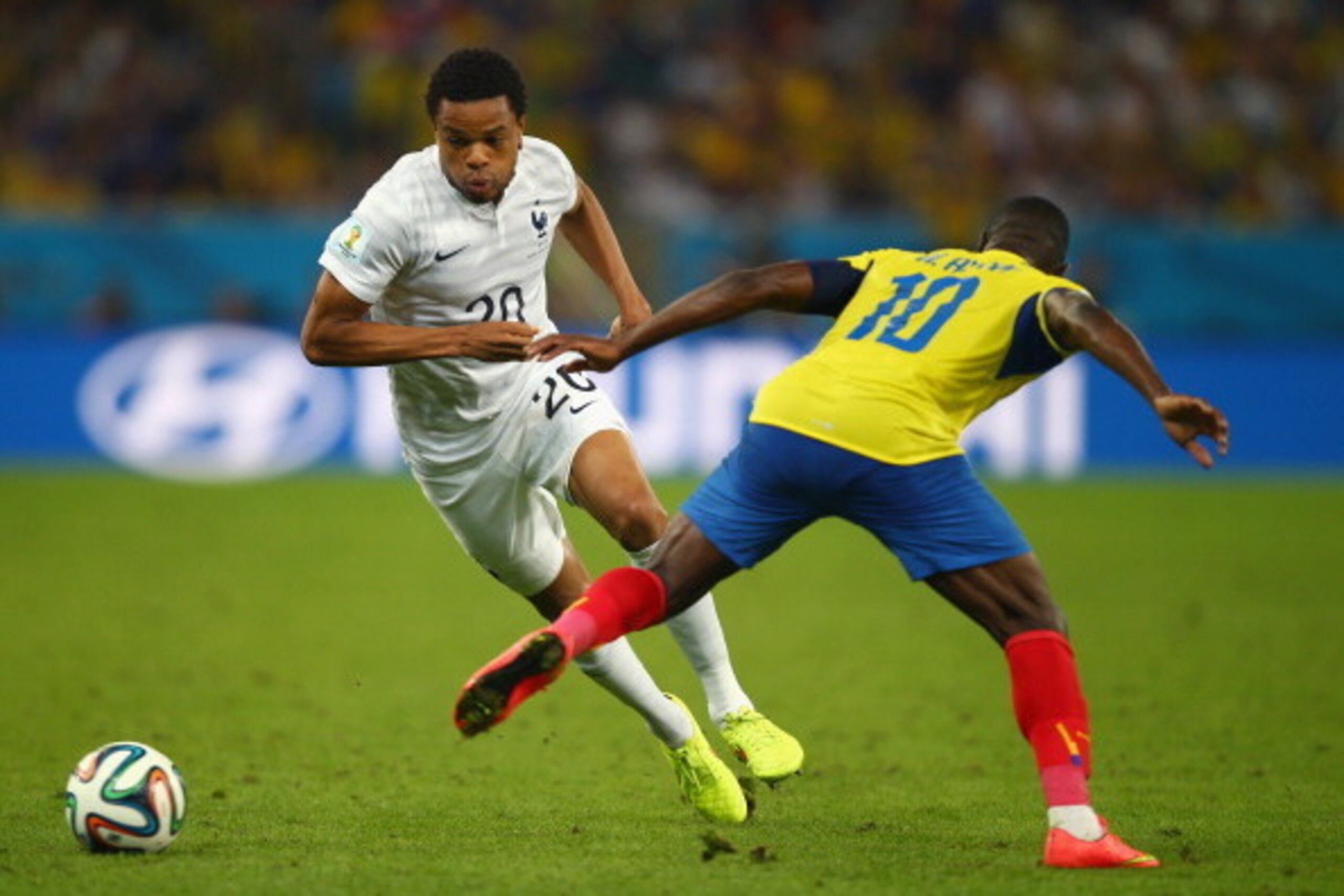 RIO DE JANEIRO, BRAZIL - JUNE 25: Loic Remy of France competes for the ball with Walter Ayovi of Ecuador during the 2014 FIFA World Cup Brazil Group E match between Ecuador and France at Maracana on June 25, 2014 in Rio de Janeiro, Brazil.  (Photo by Cliv