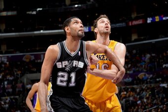 LOS ANGELES, CA - MARCH 19: Tim Duncan #21 of the San Antonio Spurs battles for position against Pau Gasol #16 of the Los Angeles Lakers at Staples Center on March 19, 2014 in Los Angeles, California. NOTE TO USER: User expressly acknowledges and agrees t