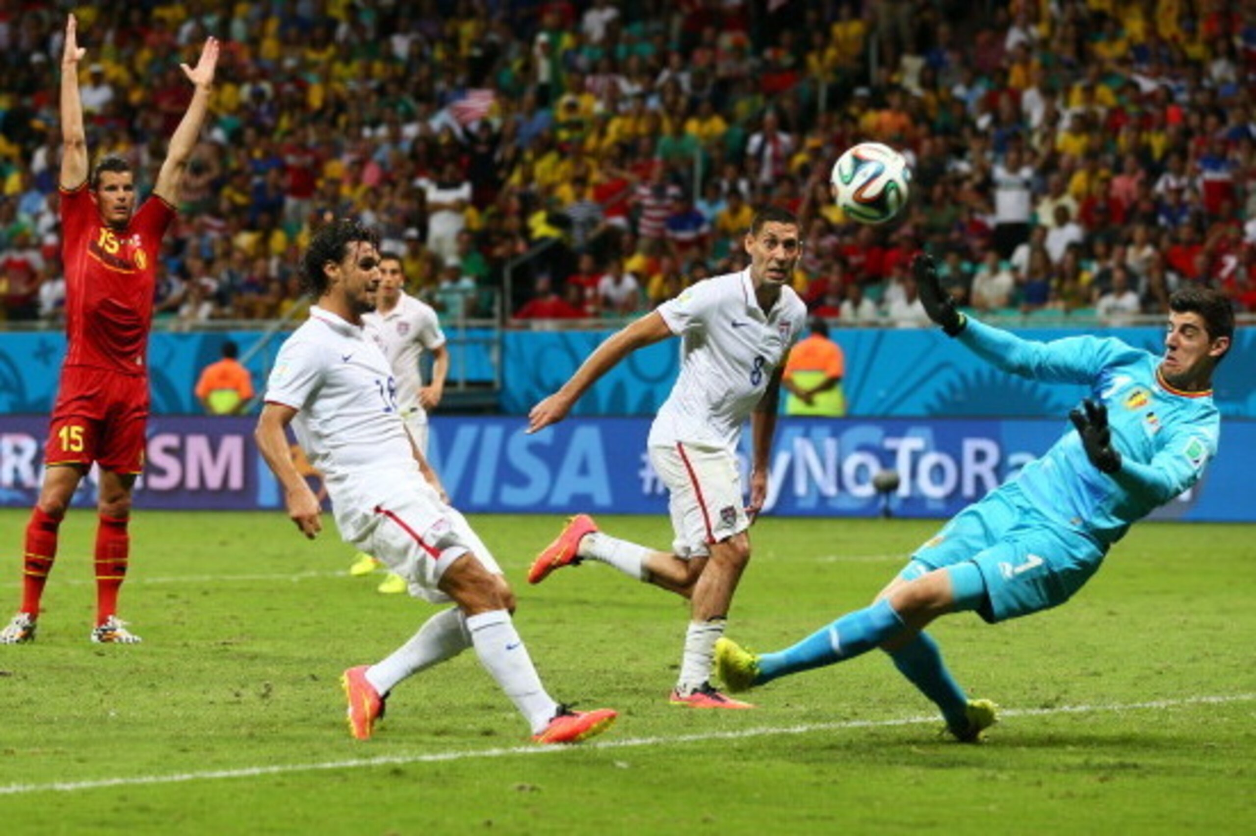 SALVADOR, BRAZIL - JULY 01:  Chris Wondolowski of the United States (L) misses a chance against Thibaut Courtois of Belgium during the 2014 FIFA World Cup Brazil Round of 16 match between Belgium and the United States at Arena Fonte Nova on July 1, 2014 i