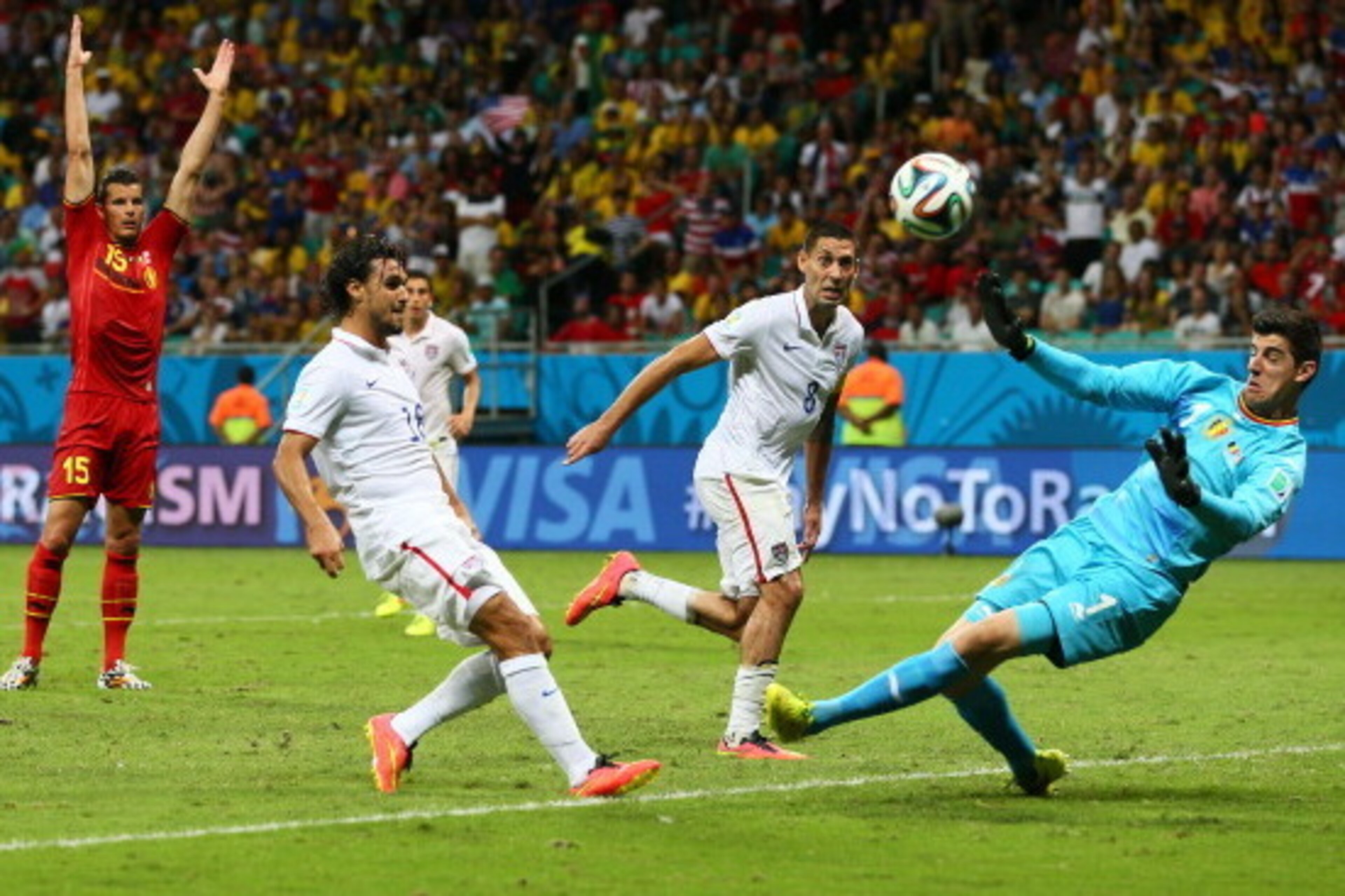 SALVADOR, BRAZIL - JULY 01:  Chris Wondolowski of the United States (L) misses a chance against Thibaut Courtois of Belgium during the 2014 FIFA World Cup Brazil Round of 16 match between Belgium and the United States at Arena Fonte Nova on July 1, 2014 i