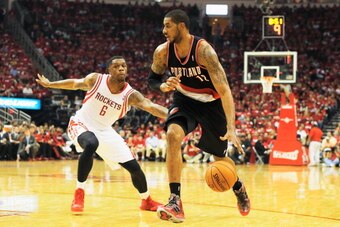 HOUSTON, TX - APRIL 23:   LaMarcus Aldridge #12 of the Portland Trail Blazers drives with the ball against Terrence Jones #6 of the Houston Rockets during the second half in Game Two of the Western Conference Quarterfinals during the 2014 NBA Playoffs at 