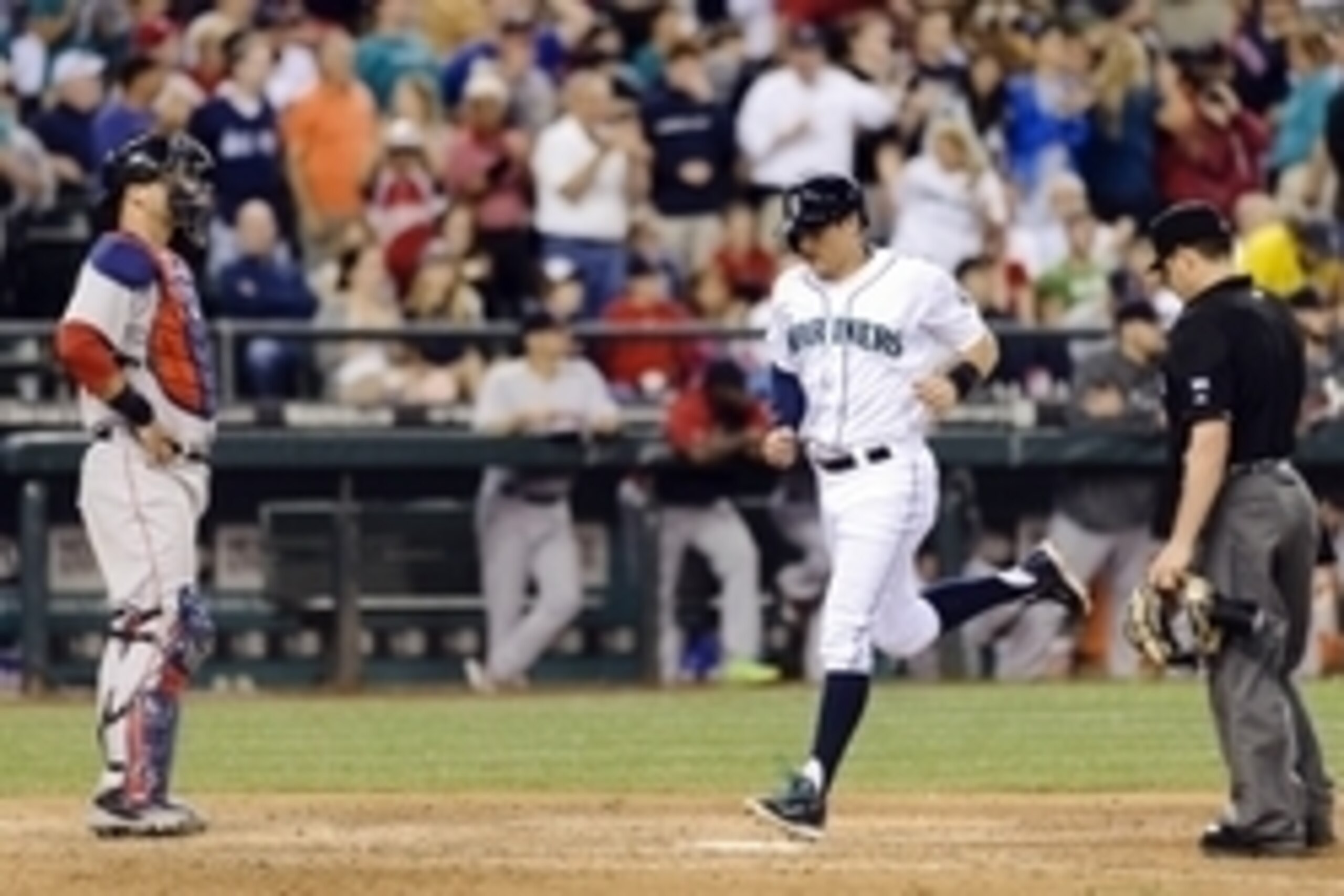 Jun 25, 2014; Seattle, WA, USA; Seattle Mariners shortstop Brad Miller (5) crosses home plate after hitting a solo home run against the Boston Red Sox during the eighth inning at Safeco Field. Mandatory Credit: Steven Bisig-USA TODAY Sports
