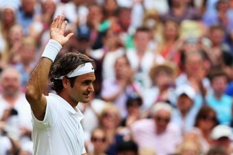 LONDON, ENGLAND - JULY 02:  Roger Federer of Switzerland celebrates after winning his Gentlemen's Singles quarter-final match against Stan Wawrinka of Switzerland on day nine of the Wimbledon Lawn Tennis Championships at the All England Lawn Tennis and Cr